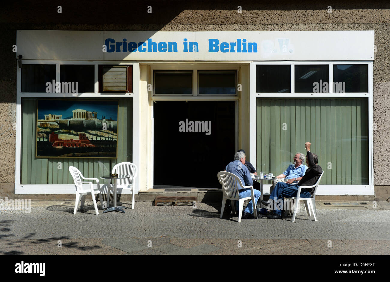 Berlin, Germany, men sit in front of the Cafe: Greeks in Berlin Stock Photo