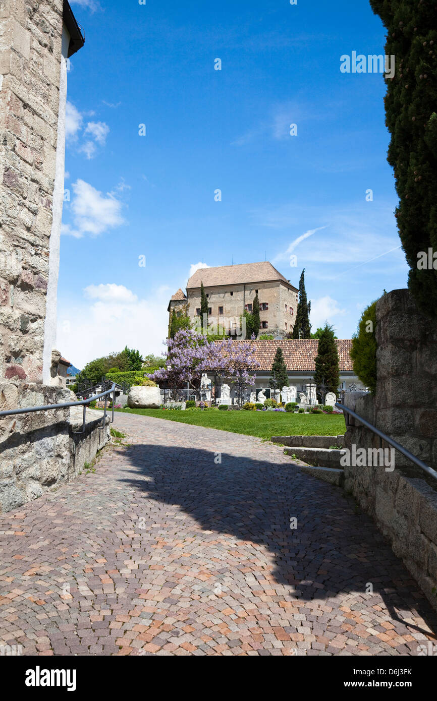 Eastern Alps, South Tyrol, Italy. Schenna (Scena) near Meran (Merano) with church Maria Aufnahme, and castle. Stock Photo