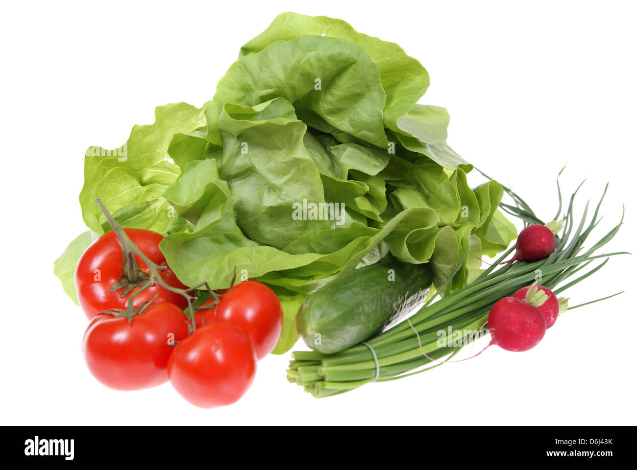 spring vegetables lying by sideon white background Stock Photo - Alamy