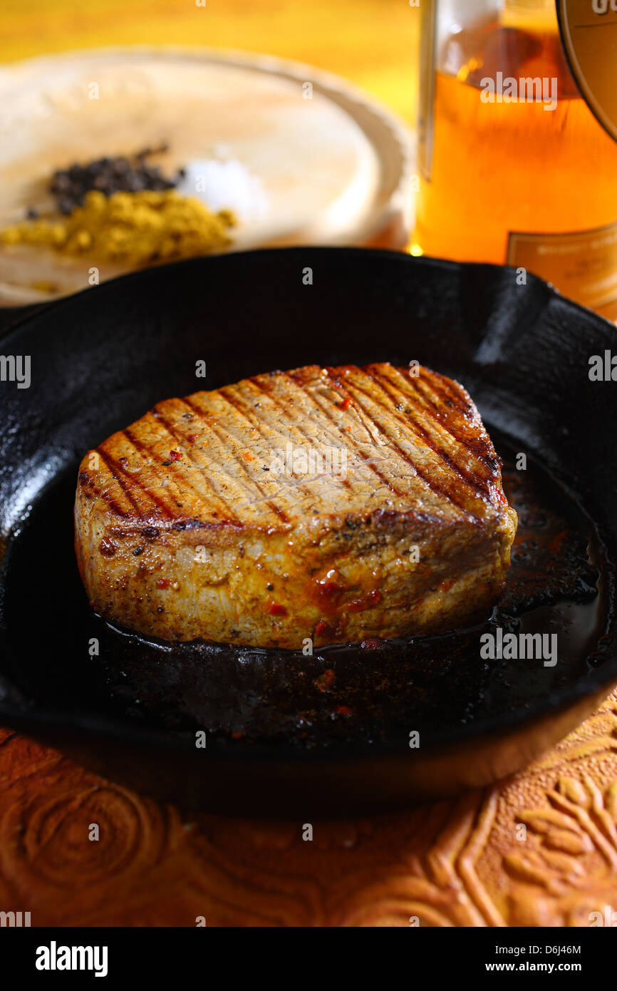 pan fried Filet mignon (fillet steak beef medallion) in the pan with