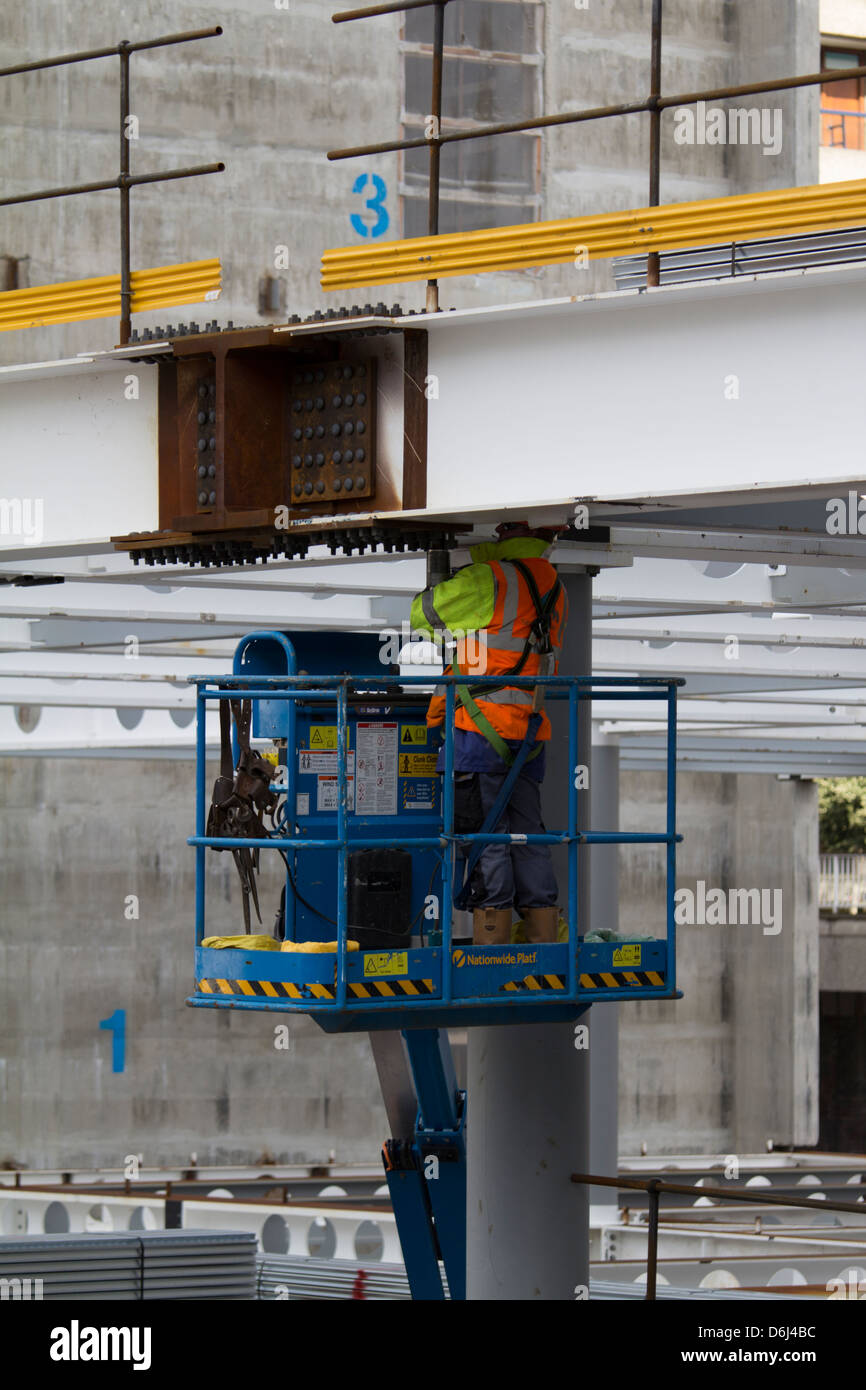 builders steel fixers erectors bolting together steel beams RSJ's