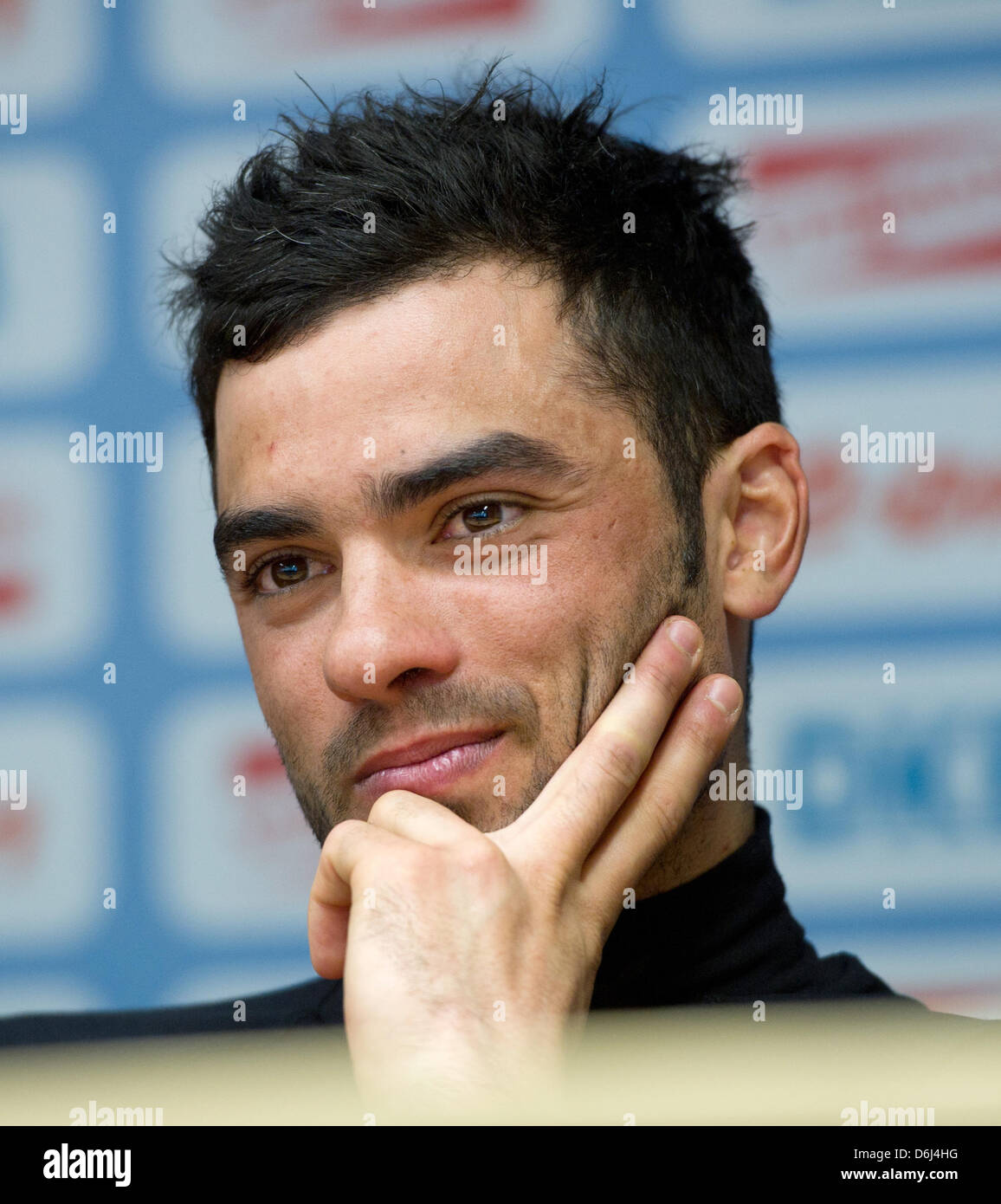 French biathlete Simon Fourcade sits during a press conference for the 