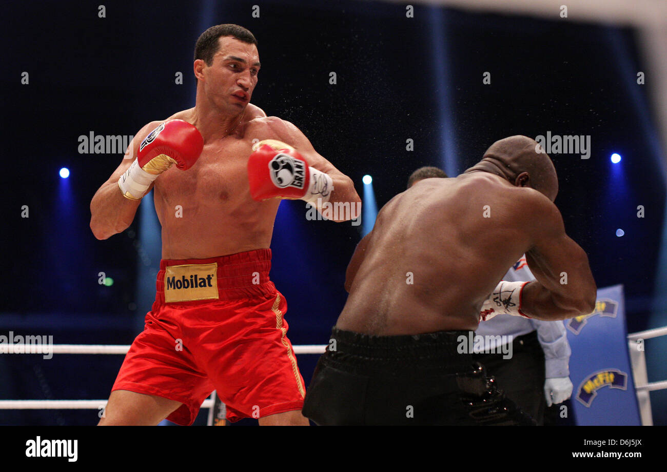 Ukrainian WBA and IBF boxing world champion Wladimir Klitschko (L) punches  French contender Jean-Marc Mormeck during the heavyweight world championship  fight at Esprit Arena in Duesseldorf, Germany, 03 March 2012. Klitschko  retained