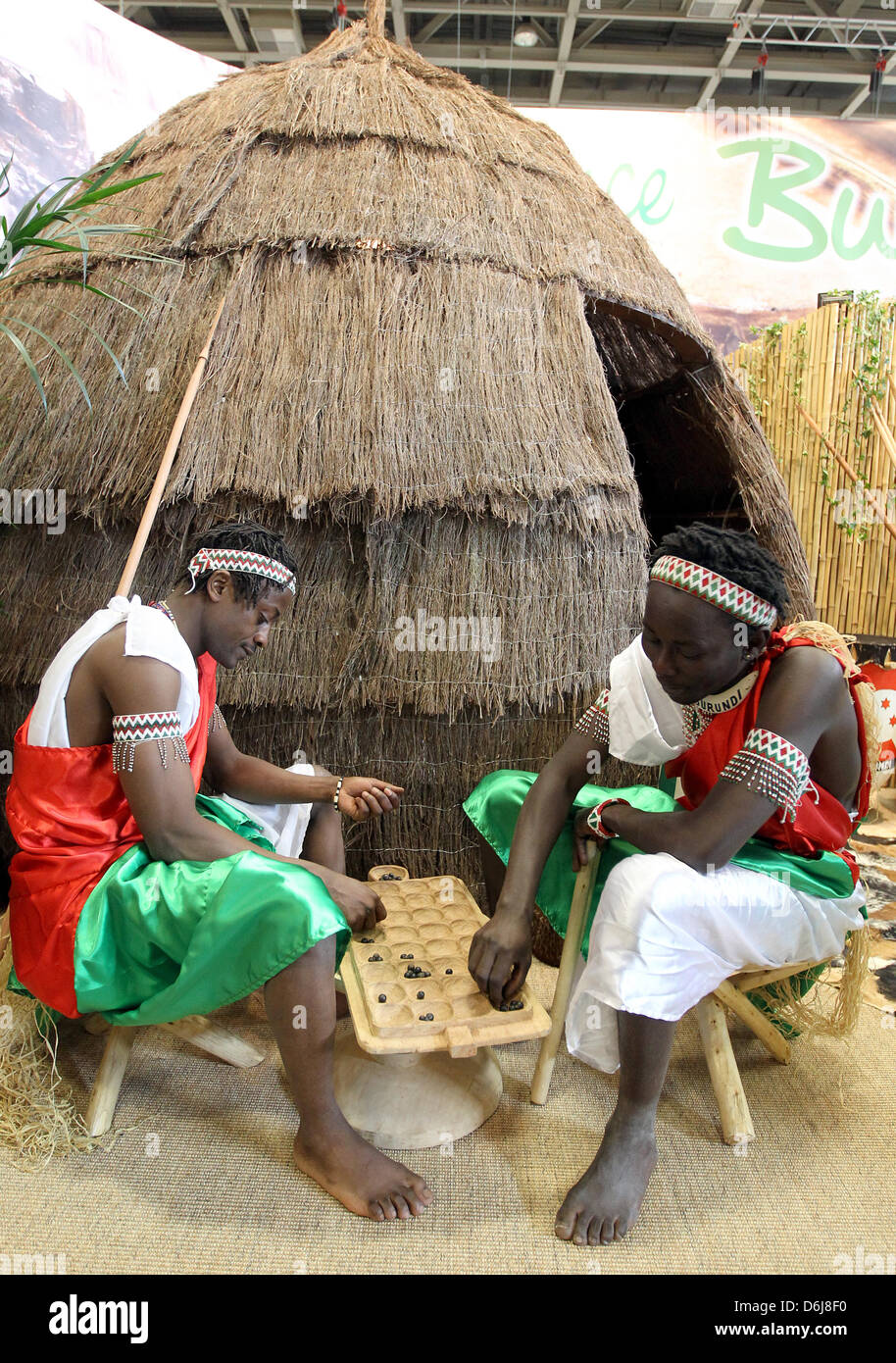 These two young men from Burundi pass the time with an African board