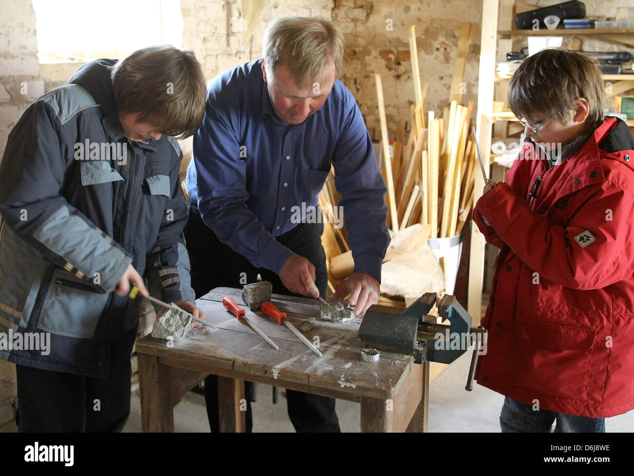 Arne Gericke C And His Sons Jonas 9 R And Lucas Work In The Stock Photo Alamy