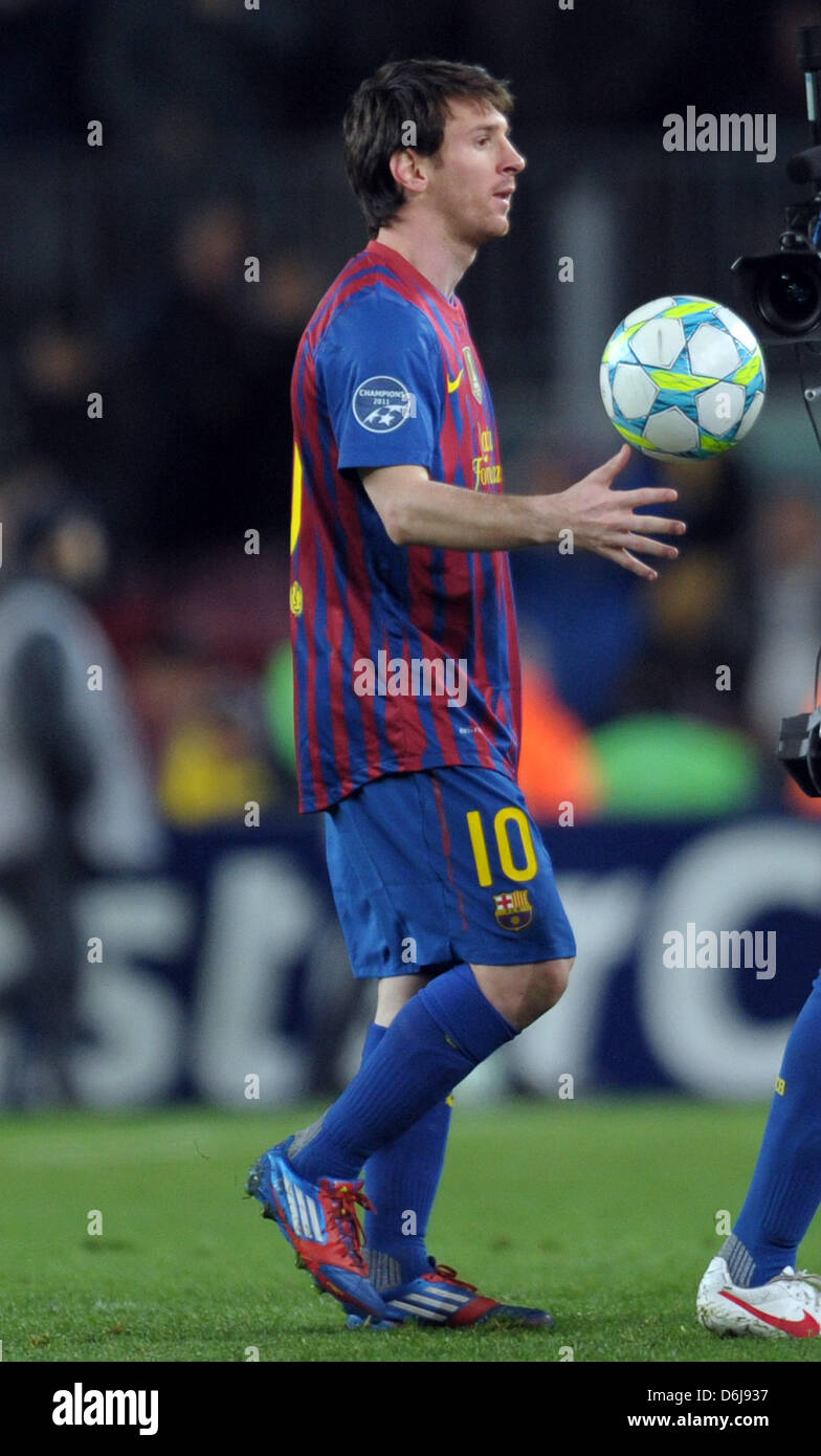 Barcelona's Lionel Messi keeps the matchball after scoring five goal in the UEFA Champions League round of 16, second leg soccer match against Bayer Leverkusen at the Camp Nou stadium in Barcelona, Spain, 07 March 2012. Barca won 7-1, Messi became the first player to score five goals in a Champions League game. Photo: Federico Gambarini dpa Stock Photo