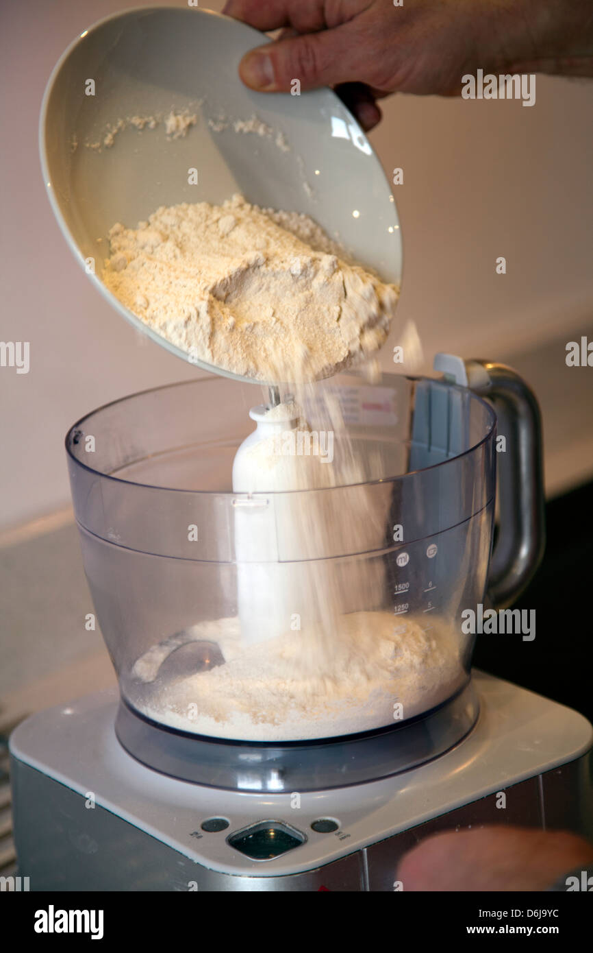 Man Pouring Flour into Mixer Stock Photo Alamy