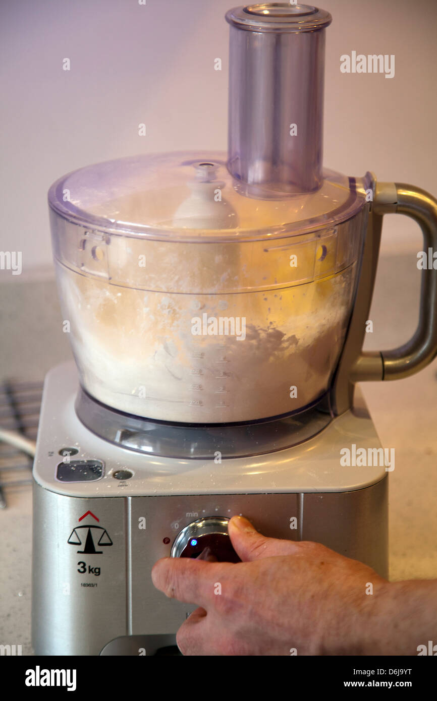 Man using Mixer to blend Flour and Butter Stock Photo Alamy