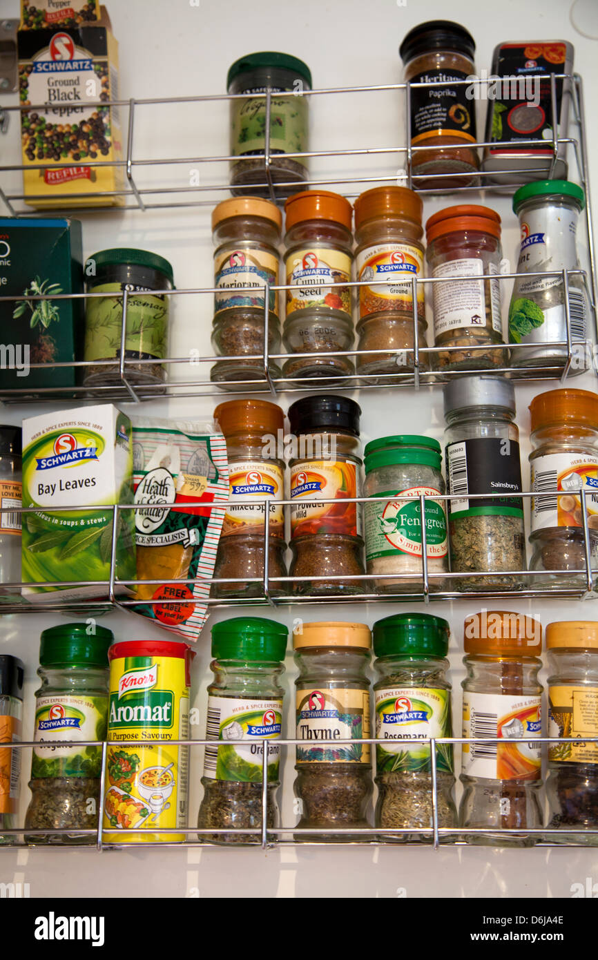 Spices on Rack on Inside of Cupboard Door Stock Photo