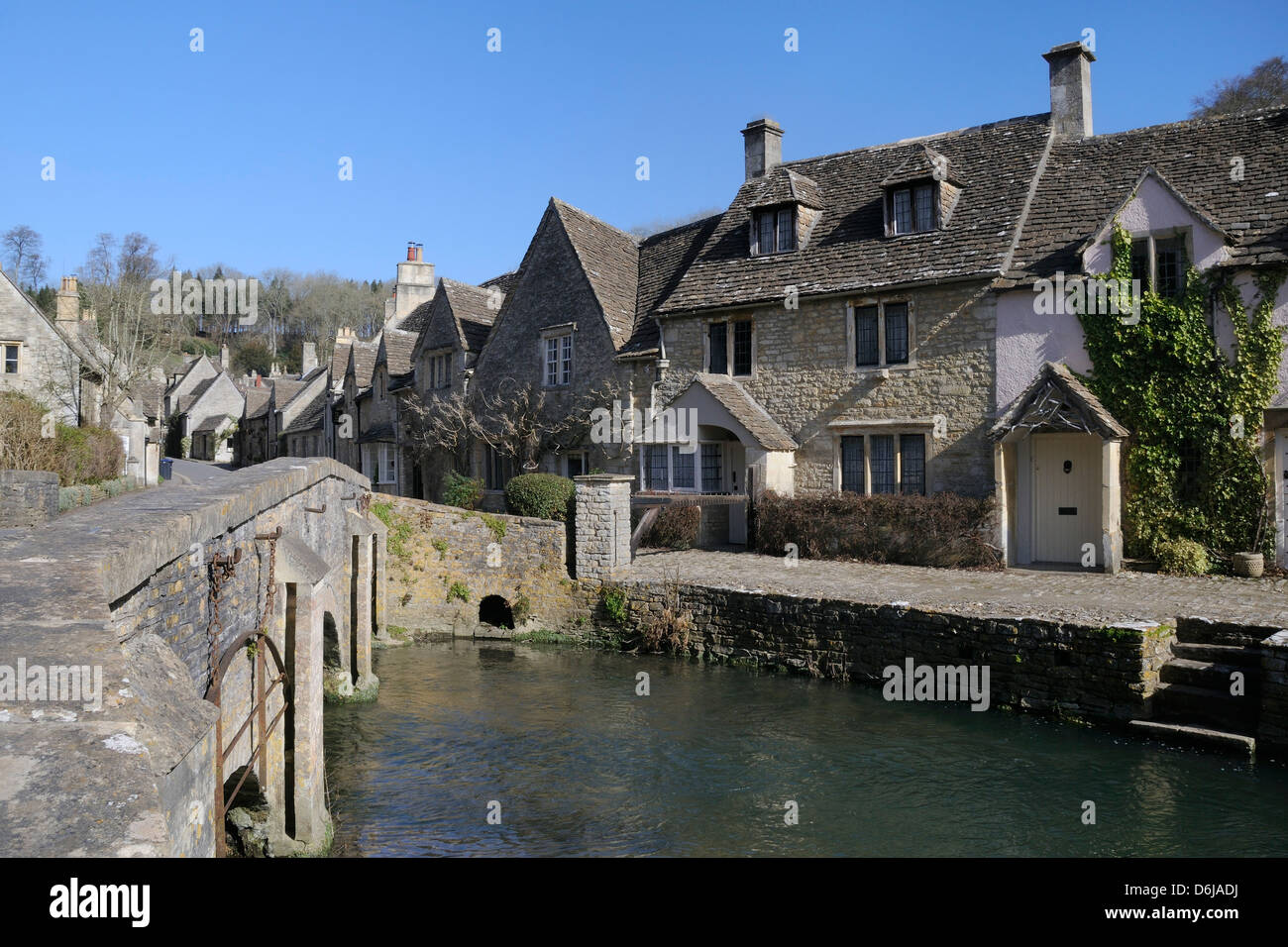 High Street and bridge over the Bybrook River, Castle Combe, Wiltshire, Engalnd, United Kingdom, Europe Stock Photo
