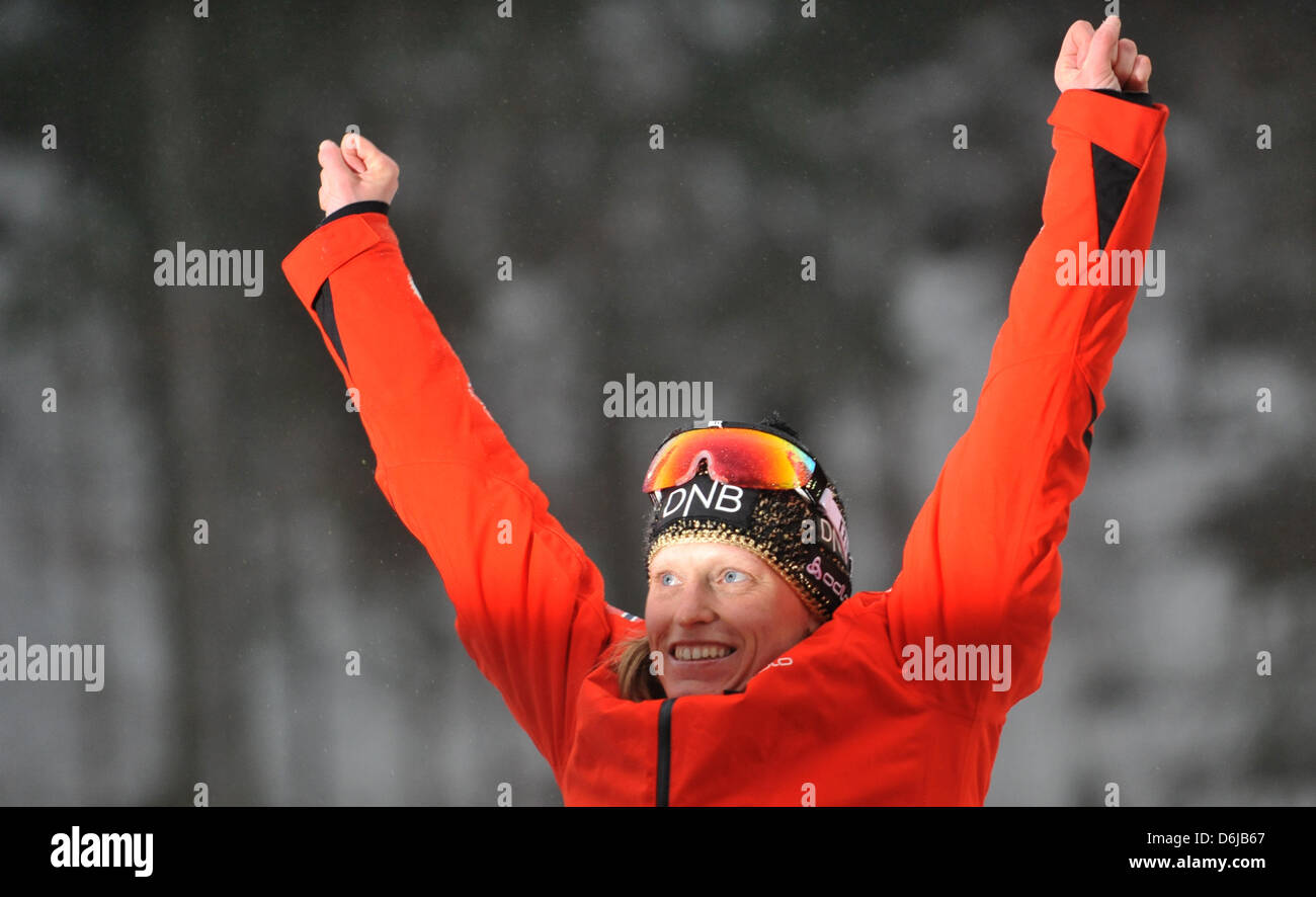 Norwegian biathlete Tora Berger cheers during the medal ceremony after winning the women's 12.5km mass start competition during the Biathlon World Championship in Ruhpolding, Germany, 11 March 2012. Berger won first place. Photo: Martin Schutt Stock Photo