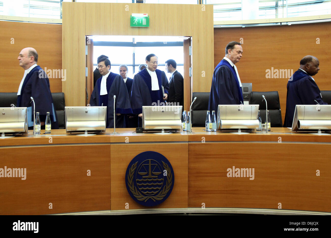 The judges arrive for the announcement of the verdict in a legal dispute between Burma and Bangladesh at the International Tribunal for the Law of the Sea (ITLOS) in Hamburg, Germany, 14 March 2012. The court had to settle a dispute over a maritime boundary between Burma and Bangladesh. Photo: BODO MARKS Stock Photo