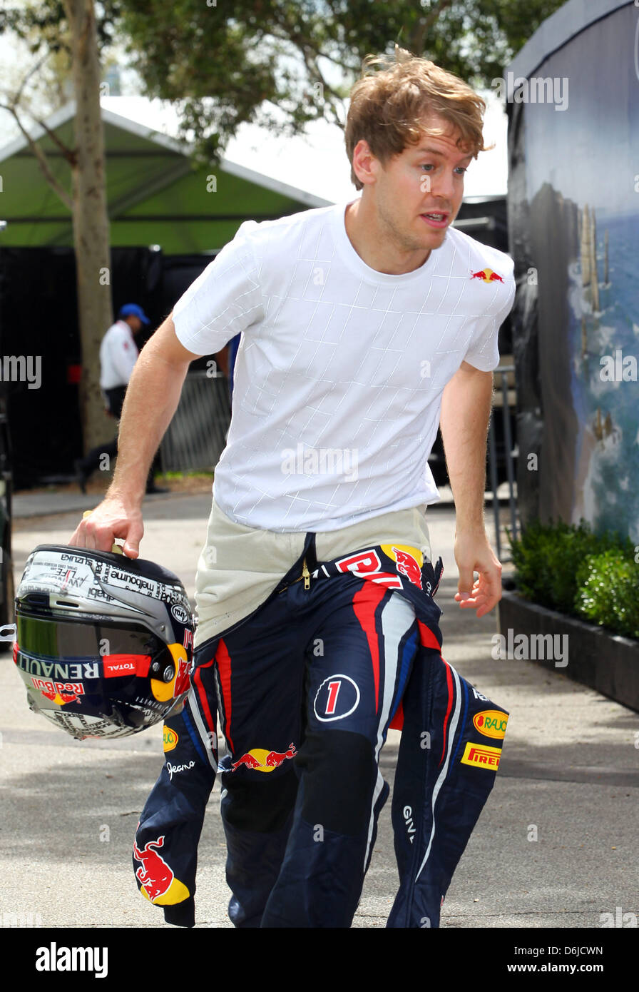 German Formula One driver Sebastian Vettel of Red Bull runs through the paddock before the Australian Formula 1 Grand Prix at the Albert Park circuit in Melbourne, Australia, 15 March 2012. The Formula One Grand Prix of Australia will take place on 18 March 2012. Photo: Jens Buettner dpa  +++(c) dpa - Bildfunk+++ Stock Photo