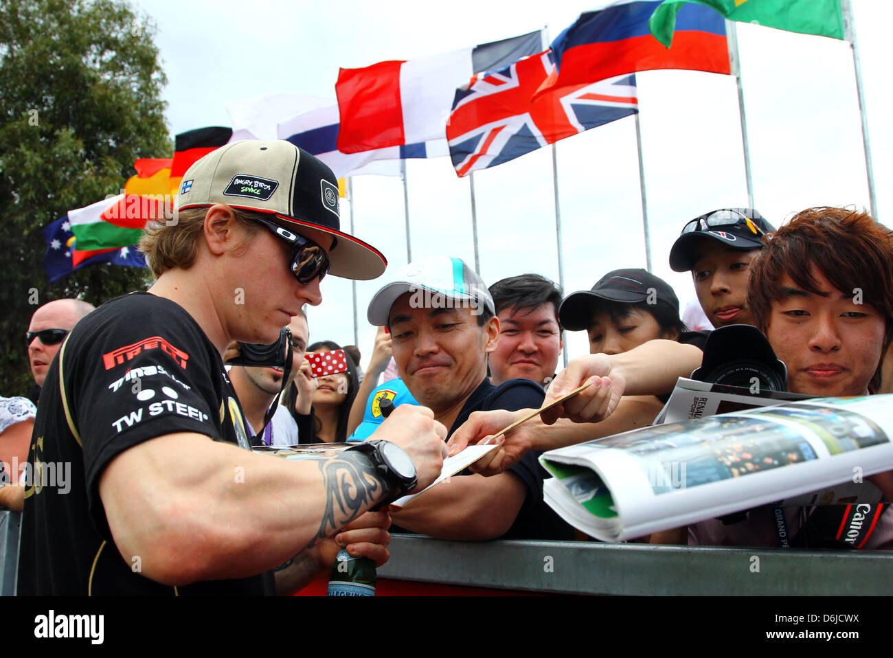 Finnish Formula One Driver Kimi Raikkonen Of Lotus Signs Autographs In Front Of The Paddock