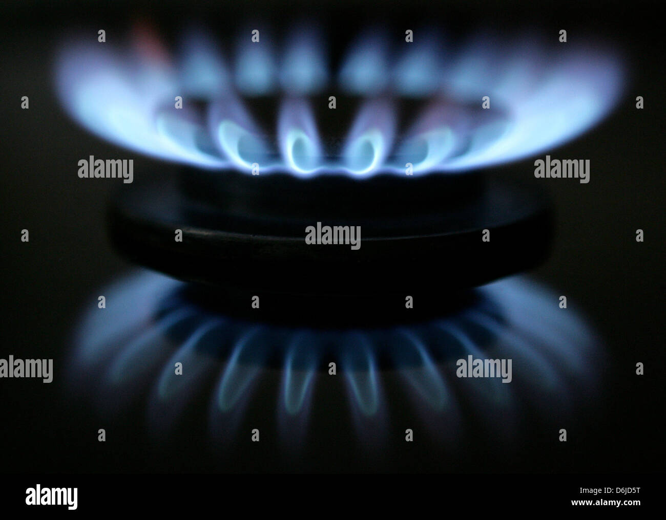 (FILE) - An archive picture, dated 4 January 2006, shows a burning gas flame on a stove in a family home in Petersdorf, Germany. In the dispute about the invalid gas pricing regulation, the German Federal Supreme Court (BGH) has now passed its verdict on the issue.  Over decades gas suppliers war allowed to continuously raise the gas prices that written down in a contractual clause Stock Photo