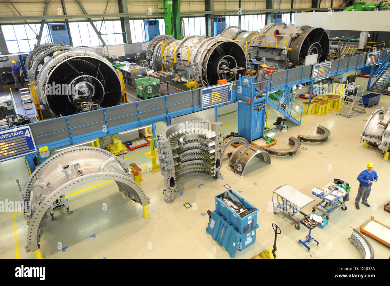 Siemens employees work on turbine blades on the premises of the Siemens ...