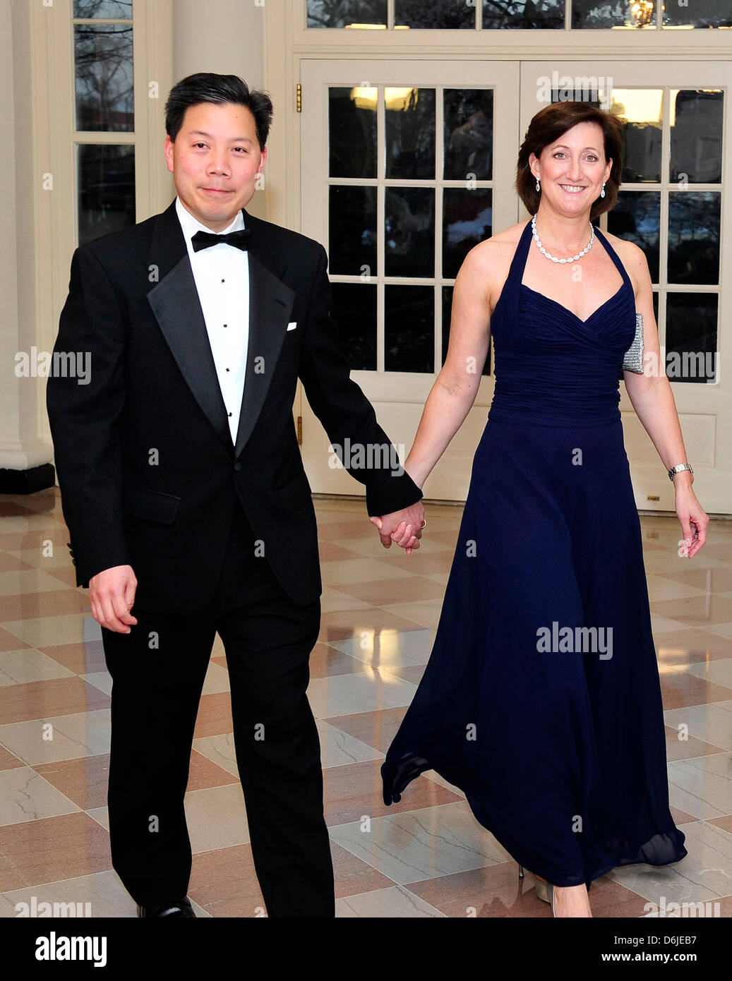 Chris Lu, Assistant to the President and Cabinet Secretary, and Katie Thomson arrive for the Official Dinner in honor of Prime Minister David Cameron of Great Britain and his wife, Samantha, at the White House in Washington, D.C. on Tuesday, March 14, 2012..Credit: Ron Sachs / CNP.(RESTRICTION: NO New York or New Jersey Newspapers or newspapers within a 75 mile radius of New York C Stock Photo