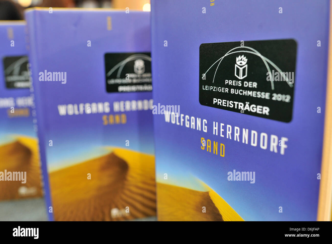 The novel 'Sand' by Wolfgang Herrndorf sits with the sticker '2012 Leipzig Book Fair Prize' at the stand of Rowolt at the Leipzig Book Fair in Leipzig, Germany, 16 March 2012. Herrndorf was awarded the prize at the start of the book fair on Thursday. Photo: HENDRIK SCHMIDT Stock Photo
