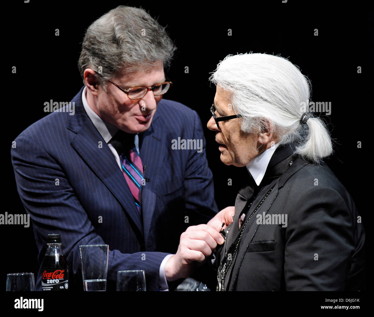 Presenter Roger Willemsen (L) stands next to fashion designer Karl Lagerfeld  during a reading at the Literature Festival Lit.Cologne in Cologne,  Germany, 16 March 2012. The festival takes place until 24 March