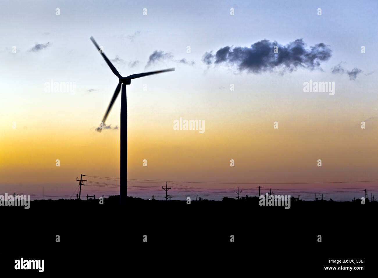 Dwarka Roadtrip. Generic landscape of windmill generator silhouetted at daybreak on the road to Dwarka, Gujarat India Stock Photo