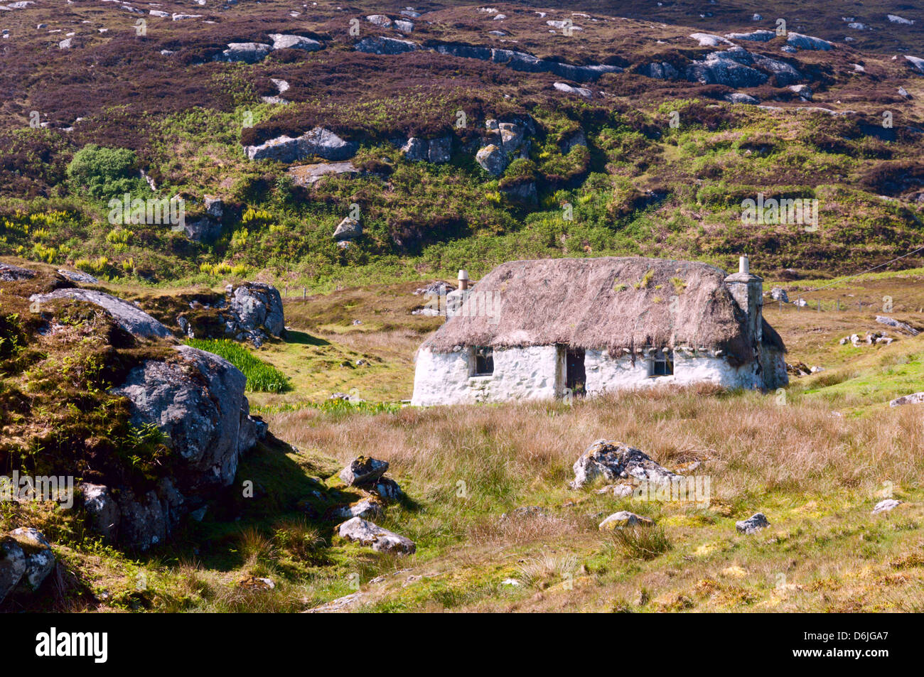 Small thatched white cottage at North Glendale on South Uist in the Outer Hebrides. Stock Photo