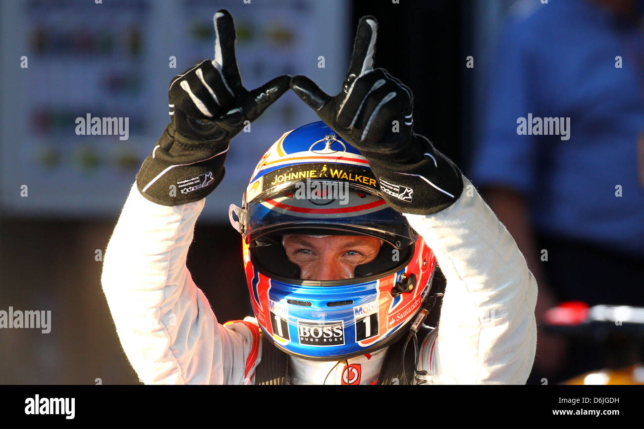 British Formula One driver Jenson Button of McLaren Mercedes celebrates ...