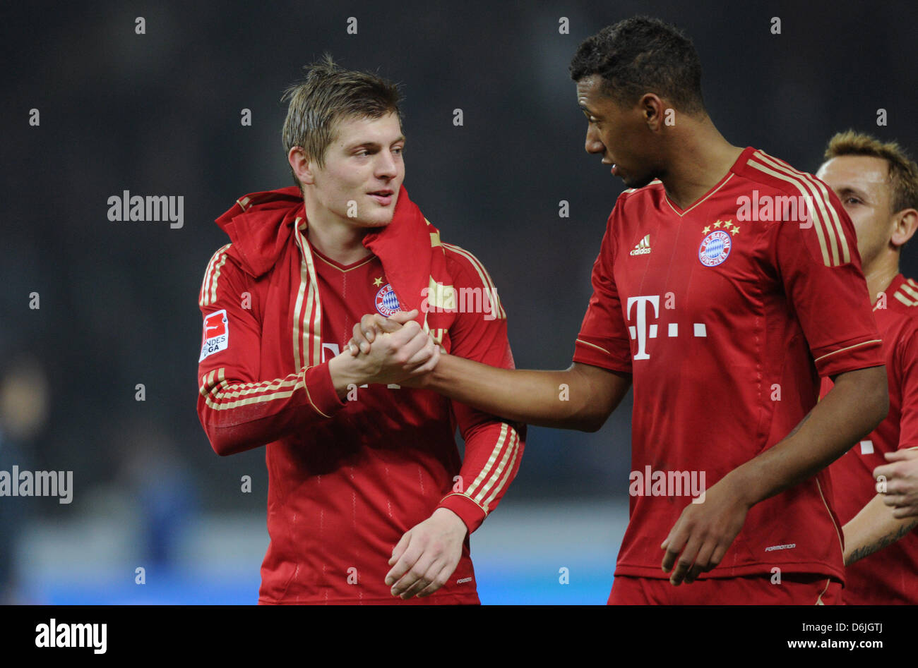 Bayern's Toni Kroos (L) and Jerome Boateng shake hands after the Bundesliga soccer match between Hertha BSC and Bayern Munich at the Olympic Stadium in Berlin, Germany, 17 March 2012. Hertha BSC lost the match 0-6. Photo: Soeren Stache Stock Photo