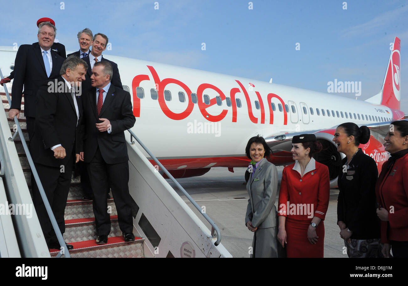 CEO of Airberlin Hartmut Mehdorn (front L) stands with Willie Walsh (IAG, front R), Bruce Ashby (oneworld, back L-R), Keith Williams (British Airways) and Tom Horton (American Airlines) on a gangway at the new 'Willy Brandt' Berlin-Brandenburg Airport in Schoenefeld, Germany, 20 March 2012. The second largest airline in Germany is celebrating its entrance into the alliance of airli Stock Photo