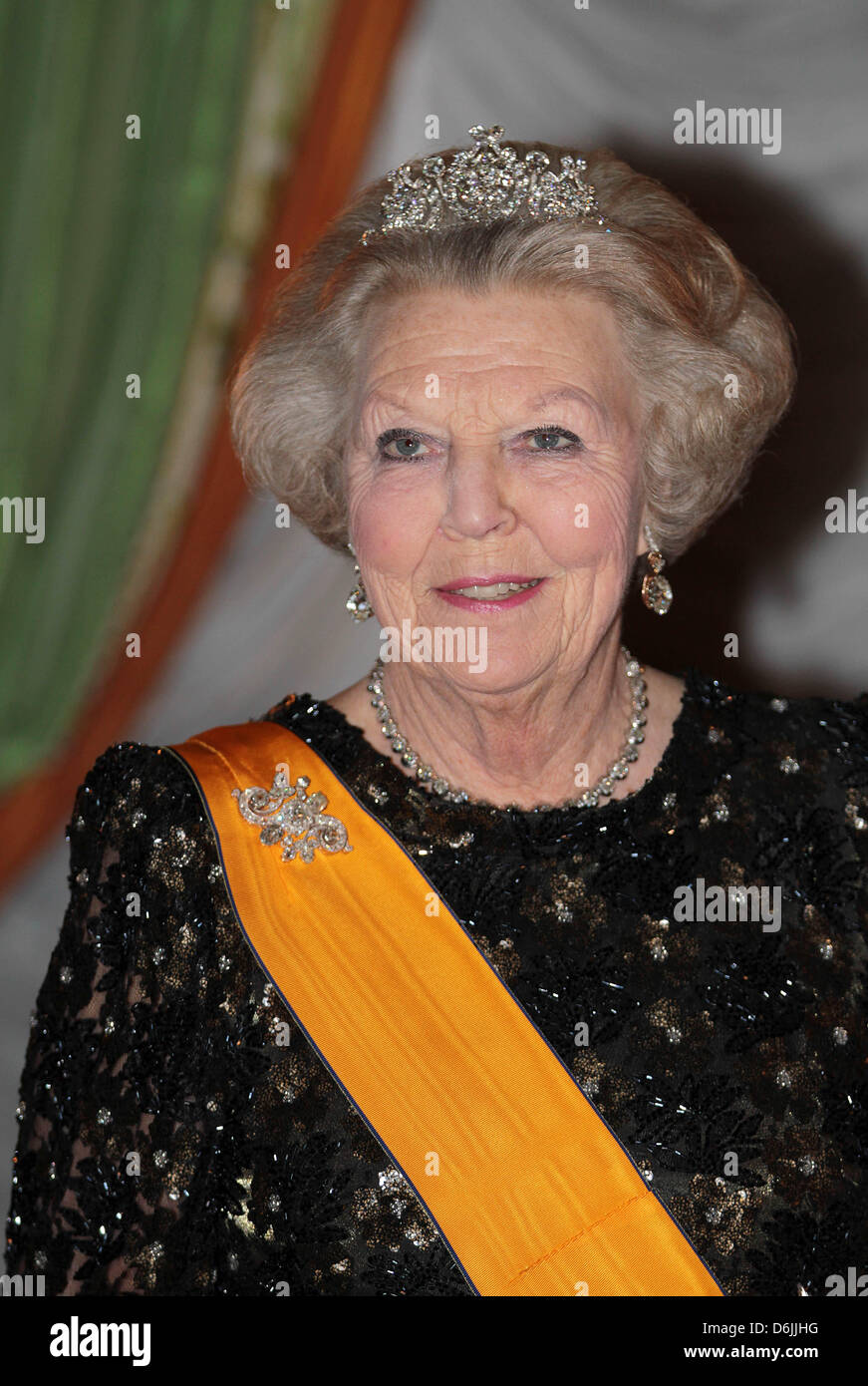 Dutch Queen Beatrix is wearing a sash and jewellery during the first