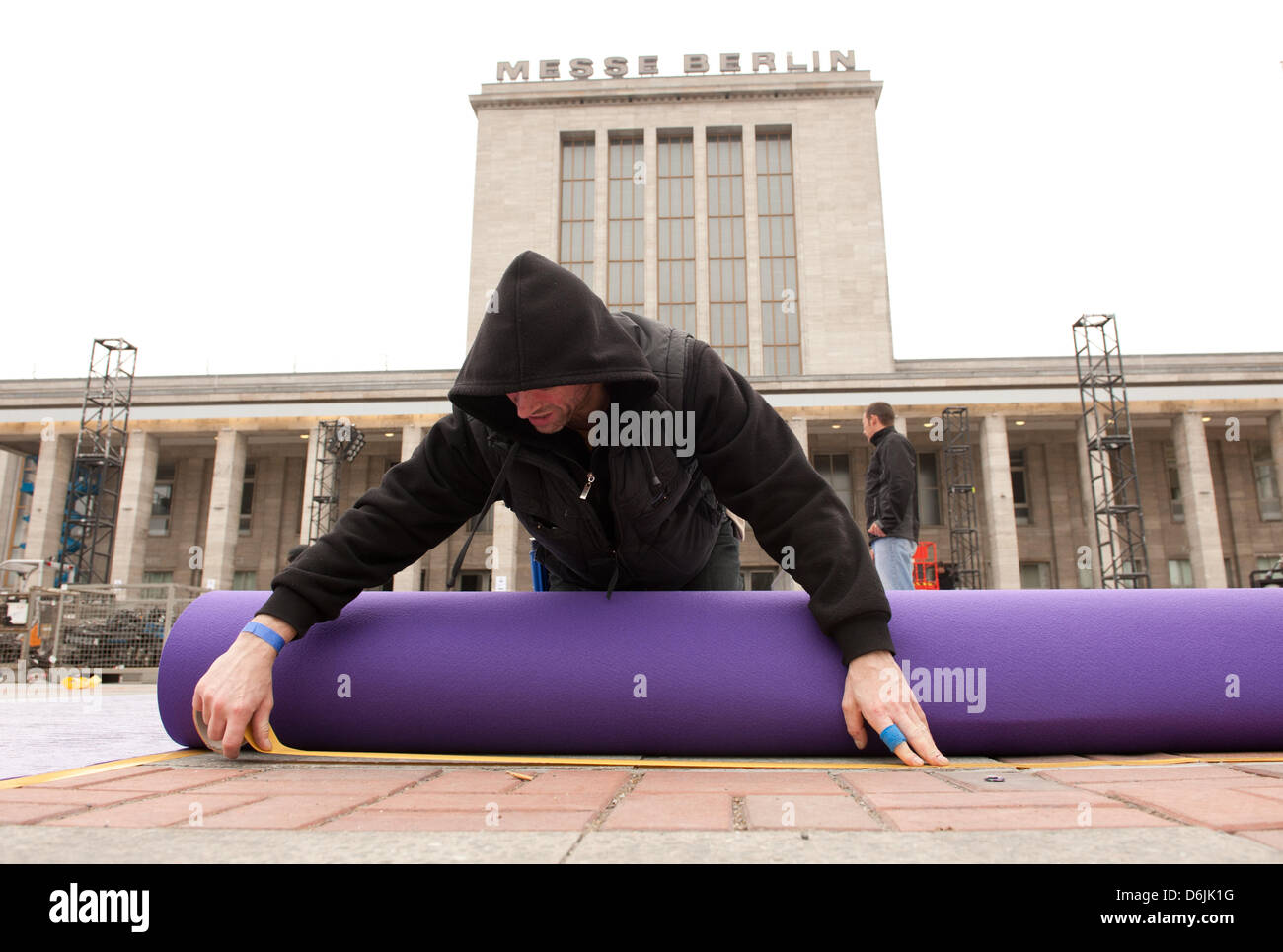 A purple carpet is laid out for the award show of the Echo music award in front of the Messehallen in Berlin, Germany, 21 March 2012. The Echo will be awarded for the 21st time in Berlin on 22 March 2012. Photo: JOERG CARSTENSEN Stock Photo