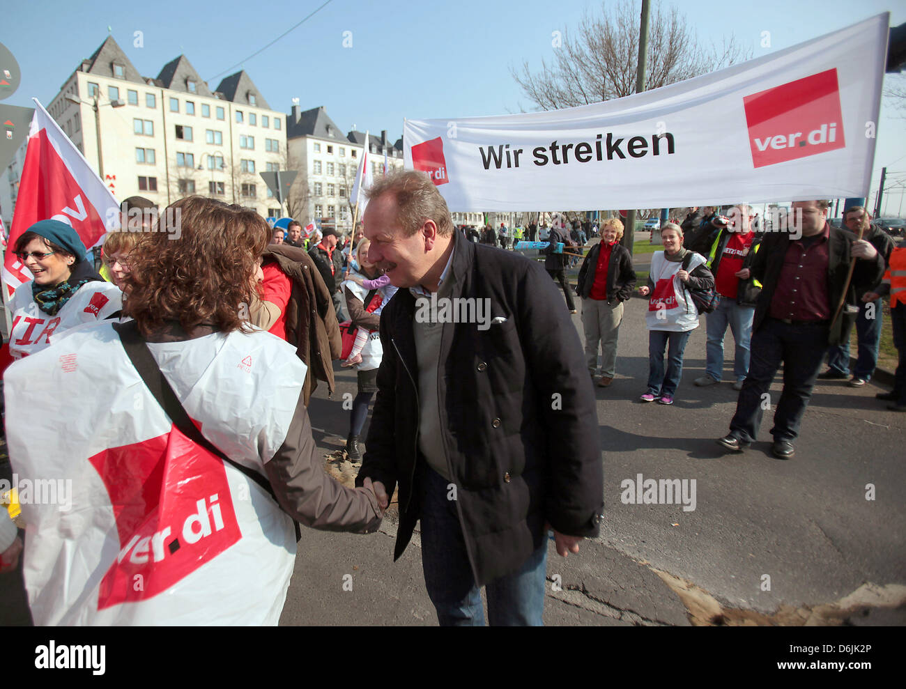 Head of trade union Verdi Frank Bsirske (C) speaks at a rally in Cologne, Germany, 21 March 2012. Work stoppages of bus and railway conductors started off the warning strikes of public sector employees in North Rhine-Westphalia. Photo: OLIVER BERG Stock Photo