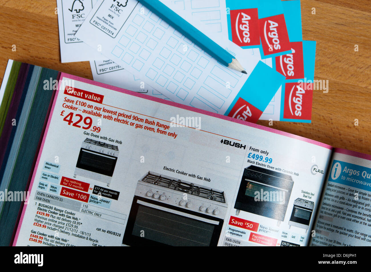 Ordering items from an in-store Argos catalogue. Stock Photo