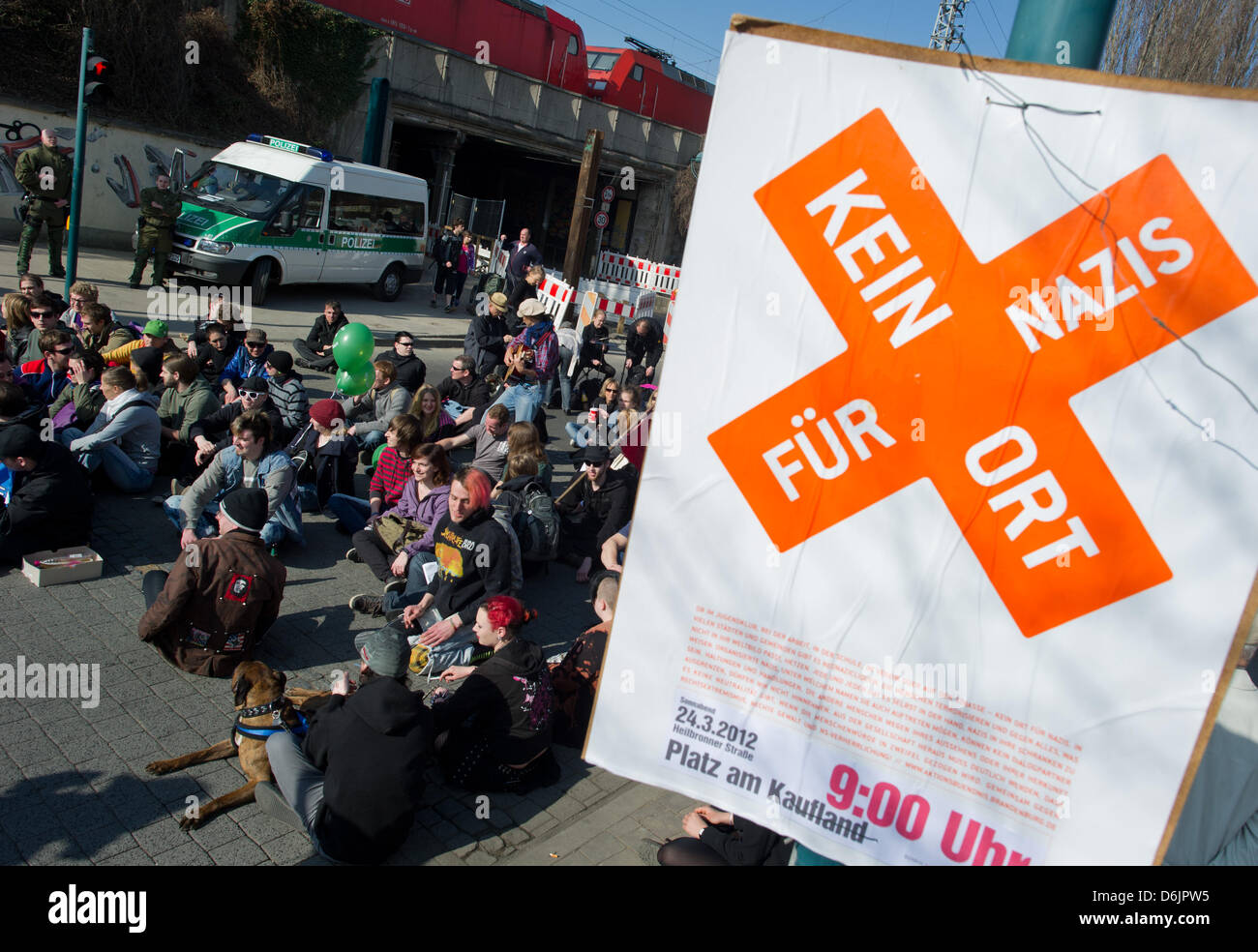 People protest against a neoNazi march with a sitin in the city