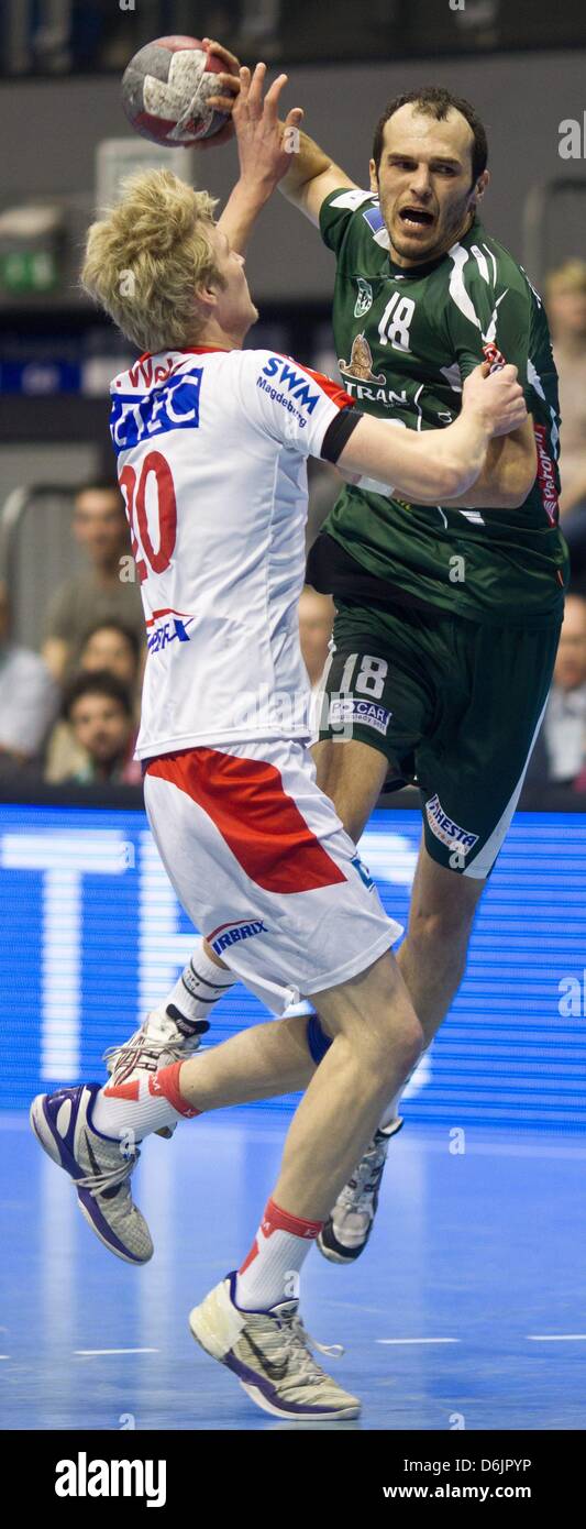 Presov's Ante Kukrika (R) goes against Magdeburg's Philipp Weber during the Handball EHF Cup men's quarter final second leg match SC Magdeburg versus HT Tatran Presov at Getec Arena in Magdeburg, Germany, 24 March 2012. Photo: JENS WOLF Stock Photo