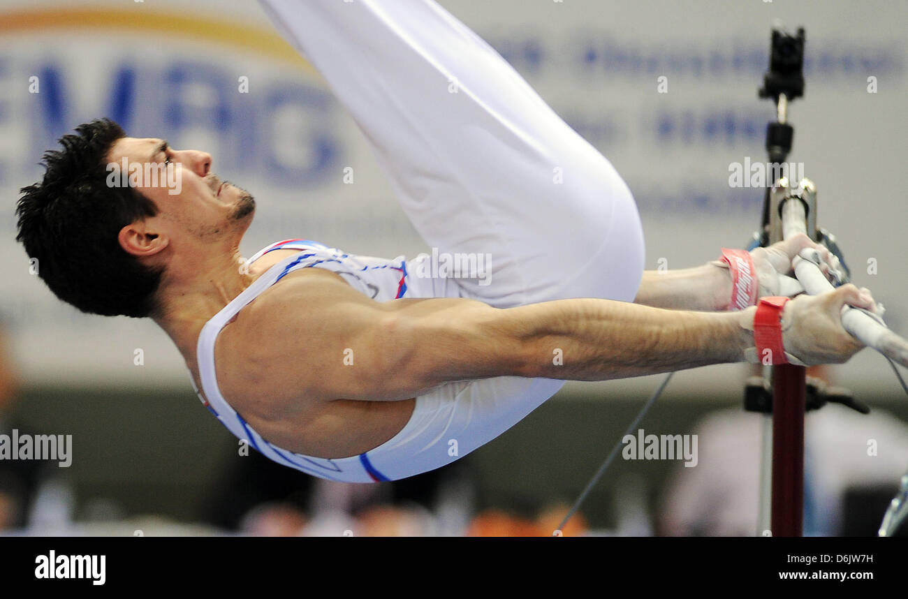 French gymnast Hamilton Sabot performs on the high bar during the world cup  'Tournament of Masters' in Cottbus, Germany, 25 March 2012. Photo: Hannibal  Stock Photo - Alamy