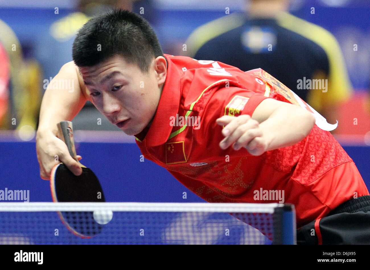China's Long Ma hits the ball during the men's group A match against Slovenia's Lasan at the 2012 World Team Table Tennis Championships at Westfalenhalle in Dortmund, Germany, 28 March 2012. Photo: Friso Gentsch Stock Photo