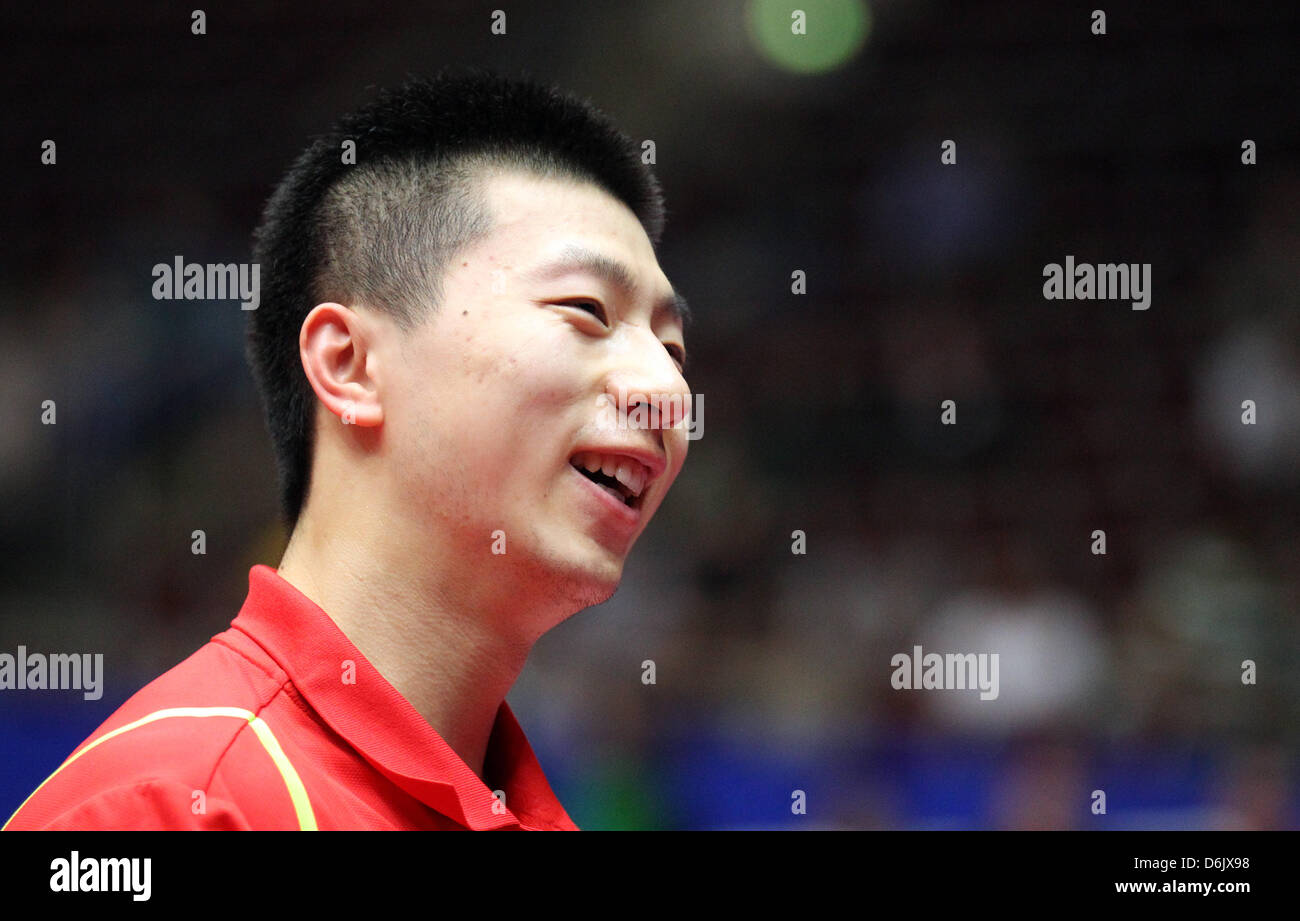 China's Long Ma smiles after winning the men's group A match against Slovenia's Lasan at the 2012 World Team Table Tennis Championships at Westfalenhalle in Dortmund, Germany, 28 March 2012. Photo: Friso Gentsch Stock Photo