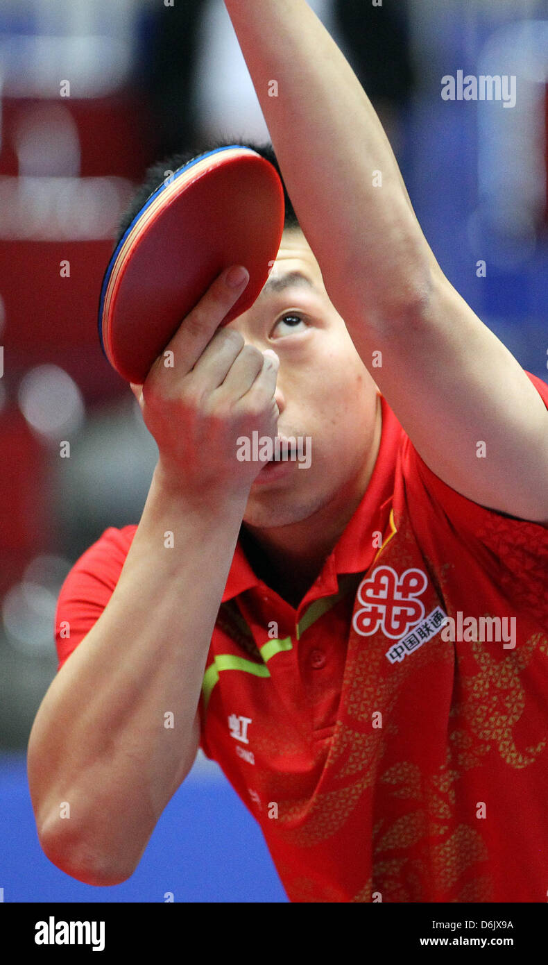 China's Long Ma hits the ball during the men's group A match against Slovenia's Lasan at the 2012 World Team Table Tennis Championships at Westfalenhalle in Dortmund, Germany, 28 March 2012. Photo: Friso Gentsch Stock Photo