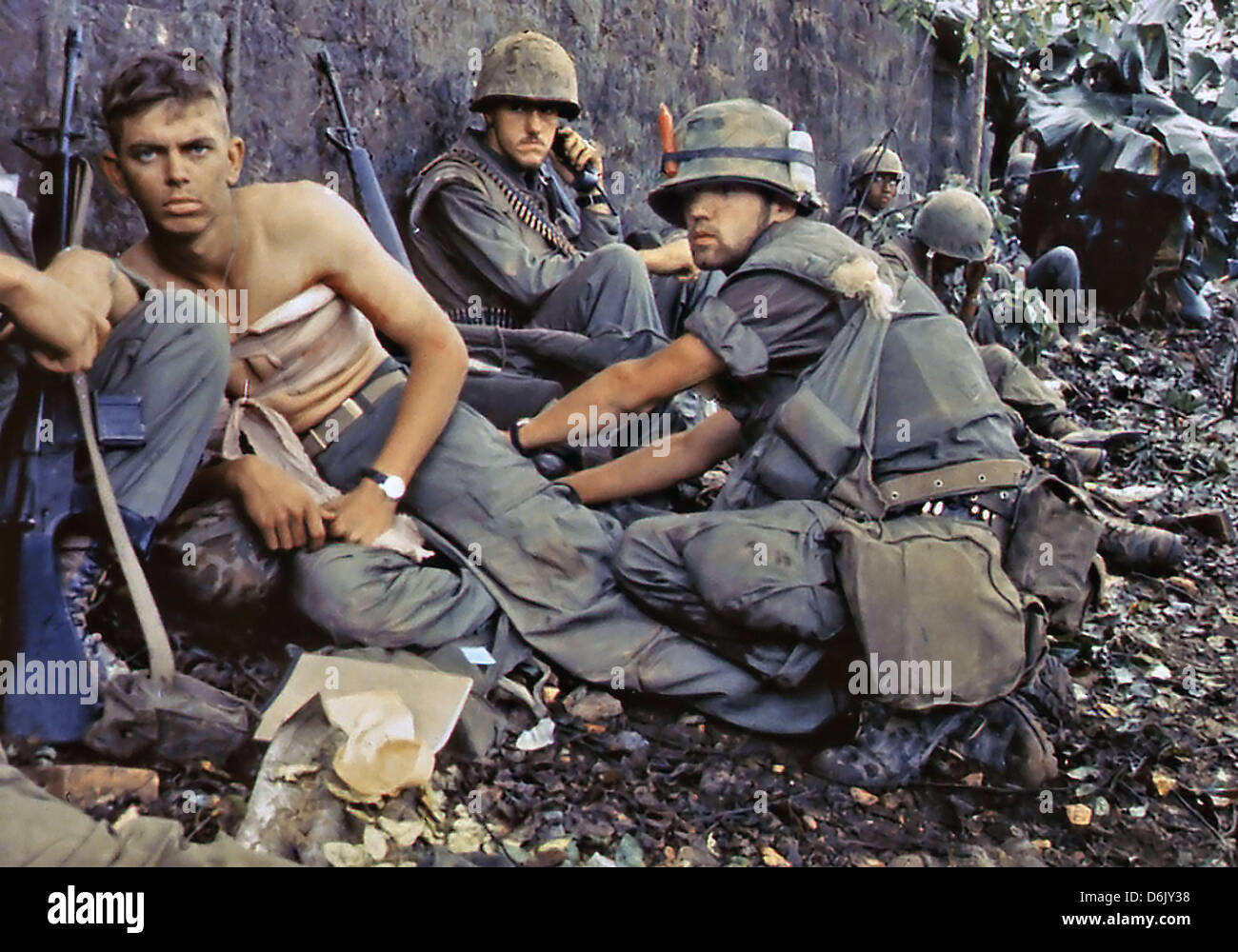 US Marine D. R. Howe treats the wounds of Private First Class D. A. Crum during the Tet Offensive June 2, 1968 in Hue City, Vietnam. Stock Photo