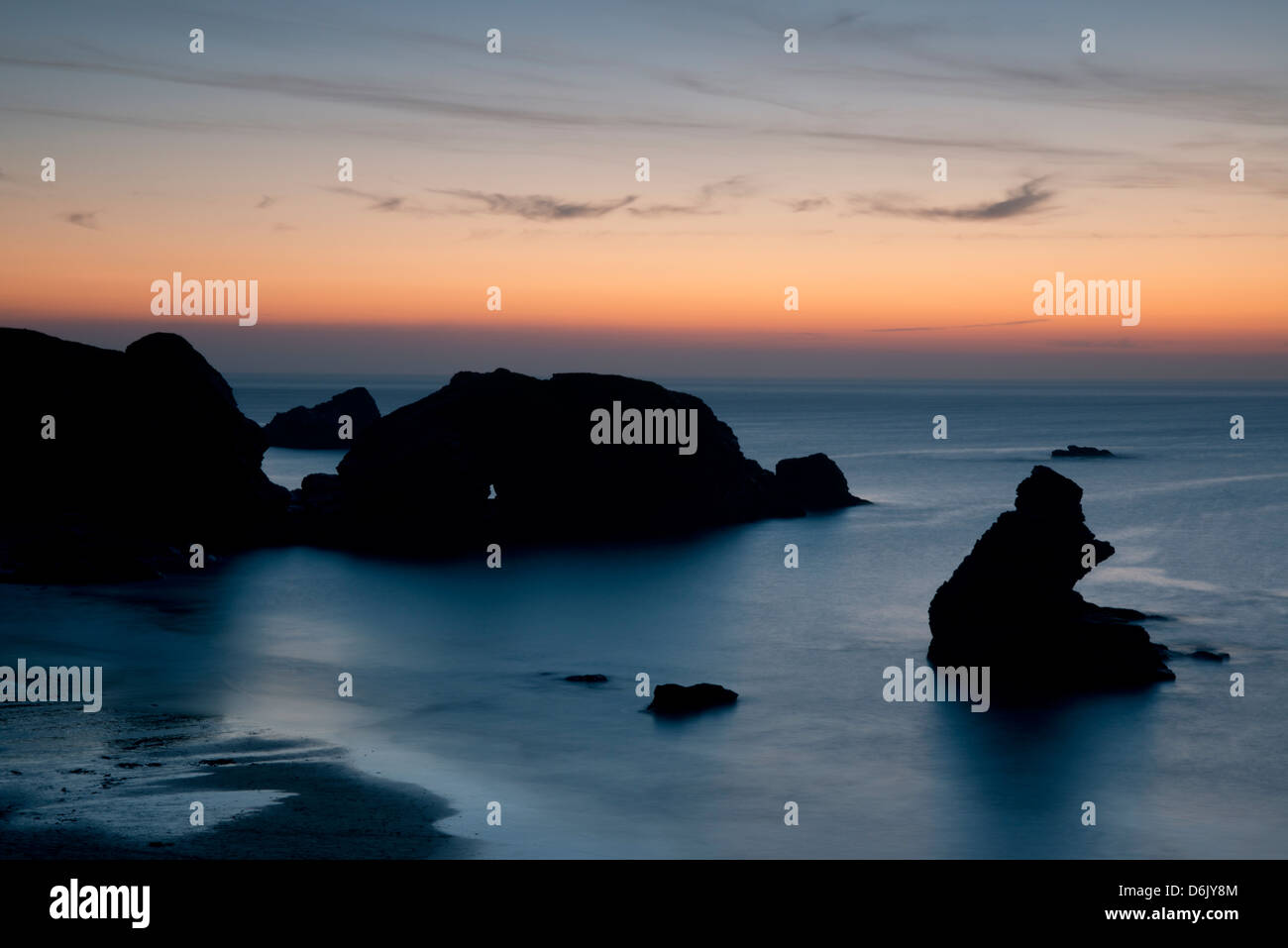 Sunset over unusual rock formations in Porthcothan Bay, Cornwall, England, United Kingdom, Europe Stock Photo