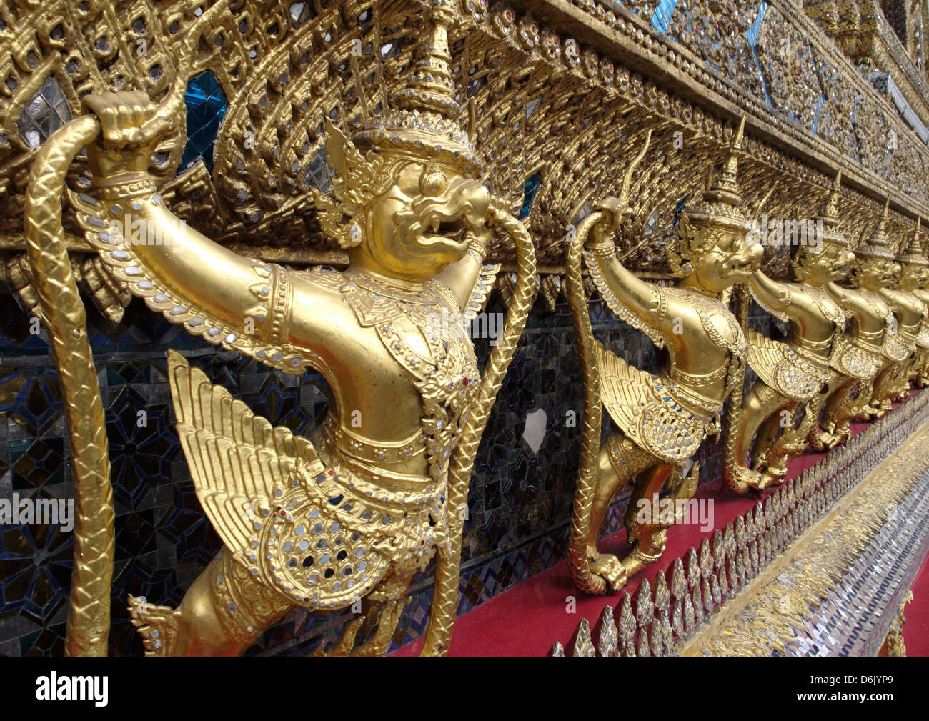 Garudas and nagas on external decorations of the Ubosoth, Wat Phra Kaew temple, Grand Palace, Bangkok, Thailand Stock Photo