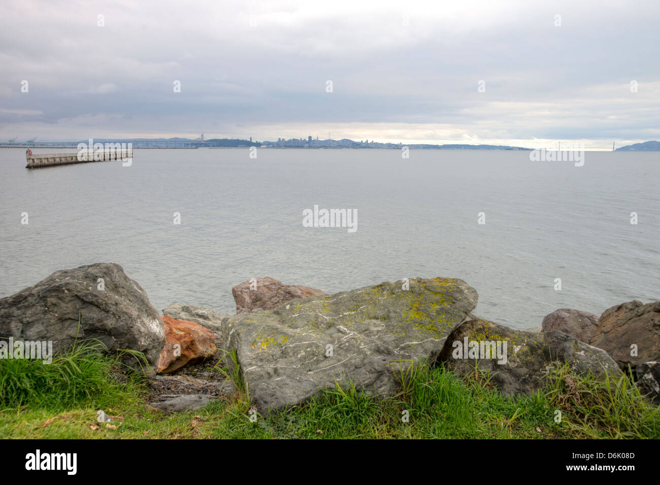 Scenic HDR image of rocky coastline near the Berkeley Marina in the San Francisco Bay. Golden Gate Bridge in background Stock Photo