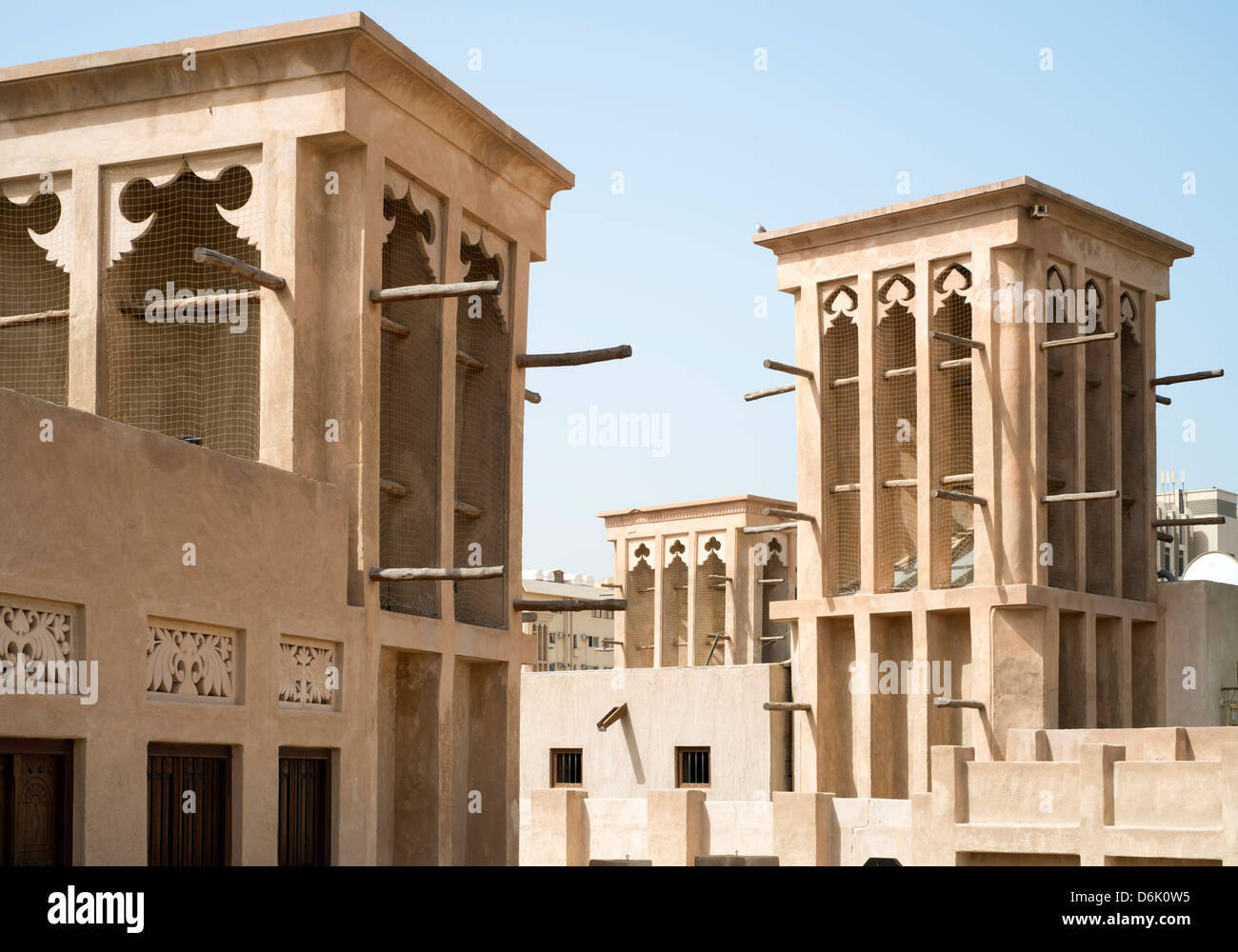 Traditional historical architecture with wind towers in Al Bastakiya historical district in Bur Dubai United Arab Emirates Stock Photo