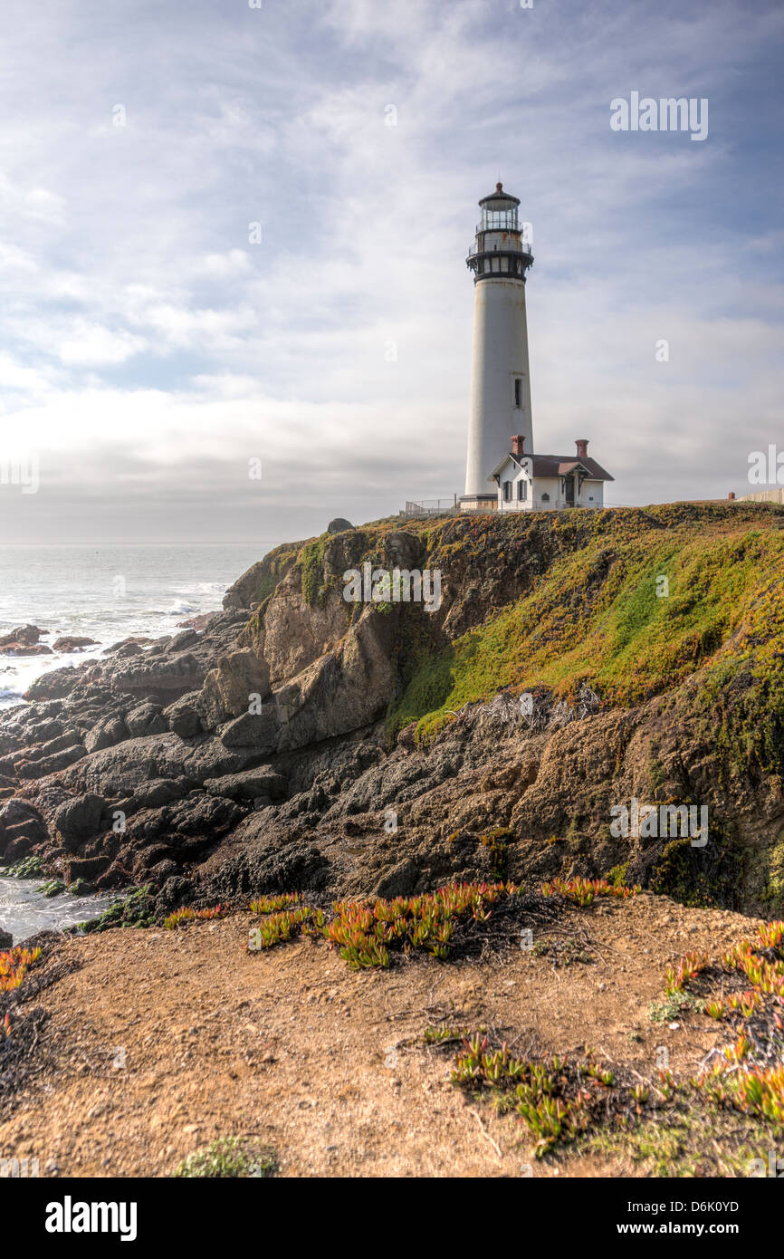 HDR landscape of Pigeon Point Lighthouse with dramatic clouds. Located on the northern coast of California Stock Photo