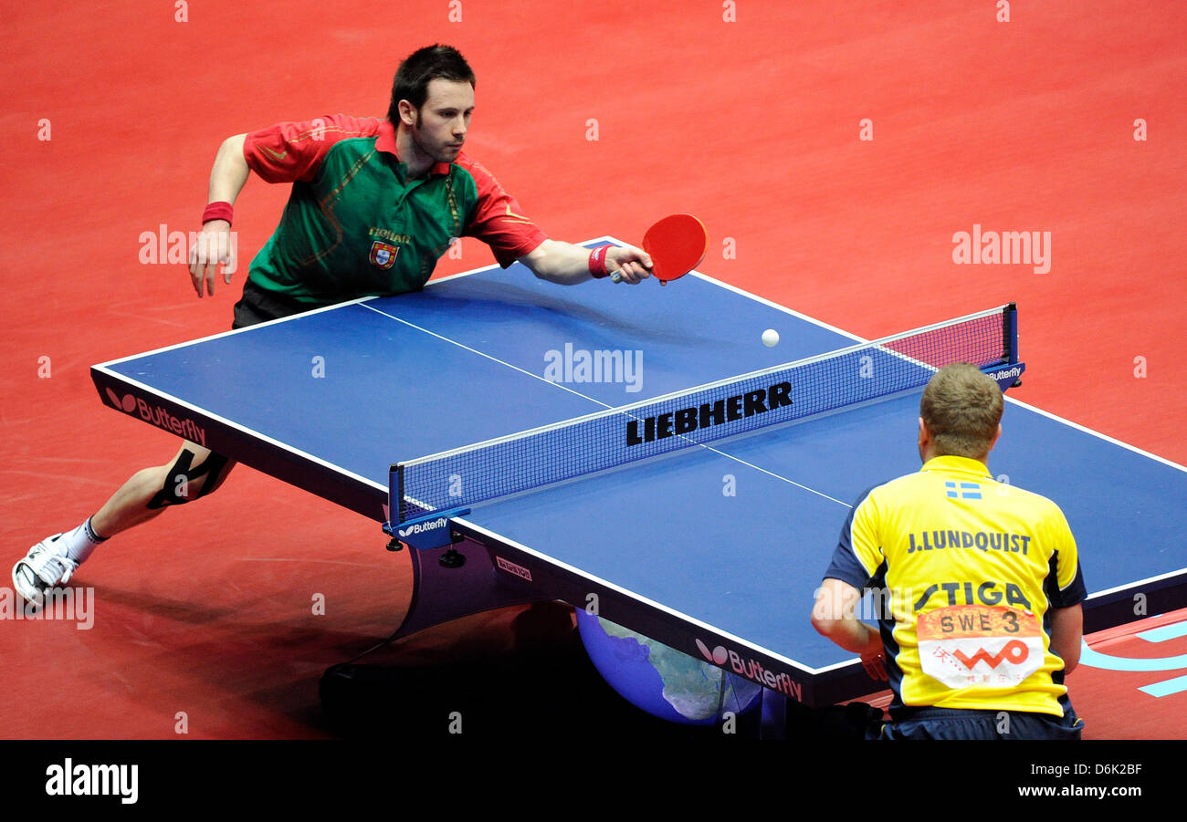 Portugal's Joao Monteiro (L) hits the ball during the men's round of 16 match against Sweden's Jens Lundqvist at the 2012 World Team Table Tennis Championships at Westfalenhalle in Dortmund, Germany, 29 March 2012. Photo: Marius Becker Stock Photo