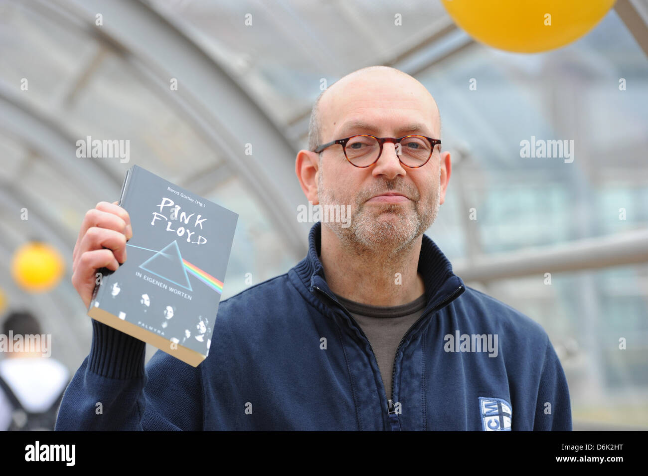 German writer and editor Bernd Guertler poses with his book about the band 'pink Floyd' at the Leipzig Book Fair in Leipzig, Germany, 15 March 2012. Sherko Fatah is the son of man from Iraqi Kurdistan and a German mother and spent the first years of his childhood in the GDR. Photo: Jens Kalaene Stock Photo