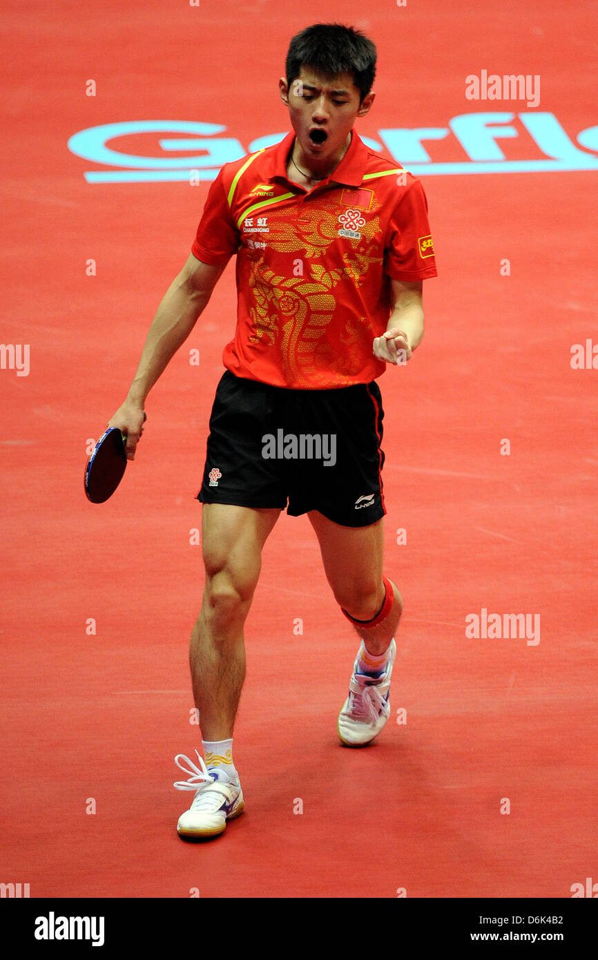 China's Zhang Jike celebrates scoring a point in the match against