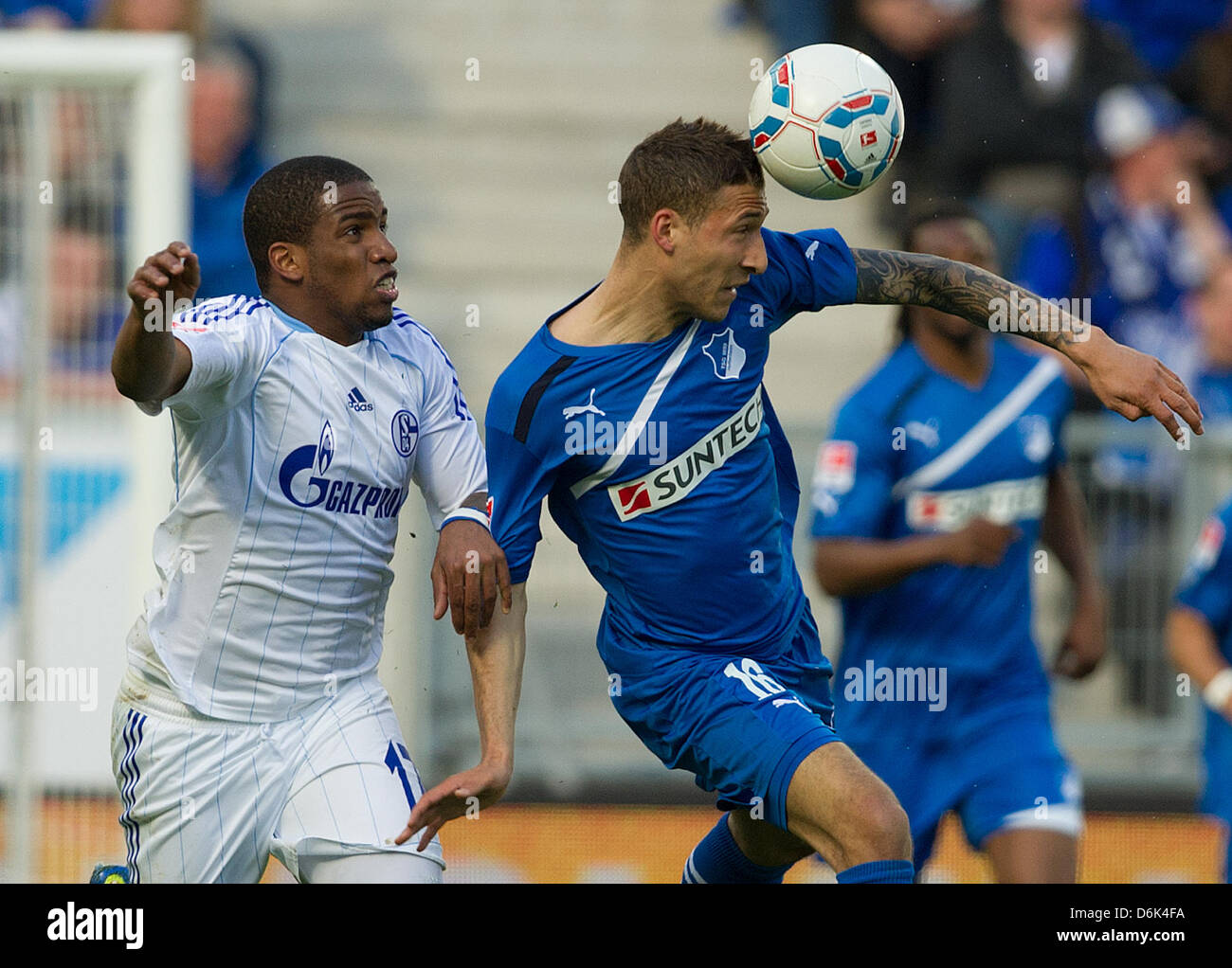 Hoffenheim's Fabian Johnson (R) vies for the ball with Schalke's Jefferson Farfan during the Bundeliga soccer match between 1899 Hoffenheim and FC Schalke 04 at the Rhein-Neckar-Arena in Sinsheim, Germany, 01 April 2012. Photo: UWE ANSPACH  (ATTENTION: EMBARGO CONDITIONS! The DFL permits the further  utilisation of the pictures in IPTV, mobile services and other new  technologies o Stock Photo