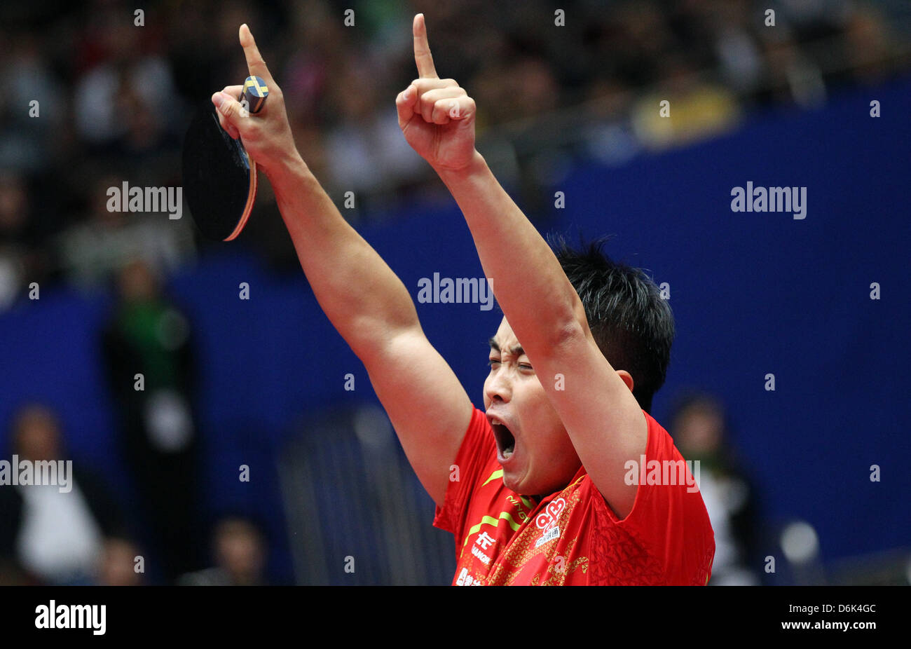 China's Wang Hao celebrates his victory against Germany's Baum and China's men's world championship title at the 2012 World Team Table Tennis Championships at Westfalenhalle in Dortmund, Germany, 01 April 2012. Photo: FRISO GENTSCH Stock Photo