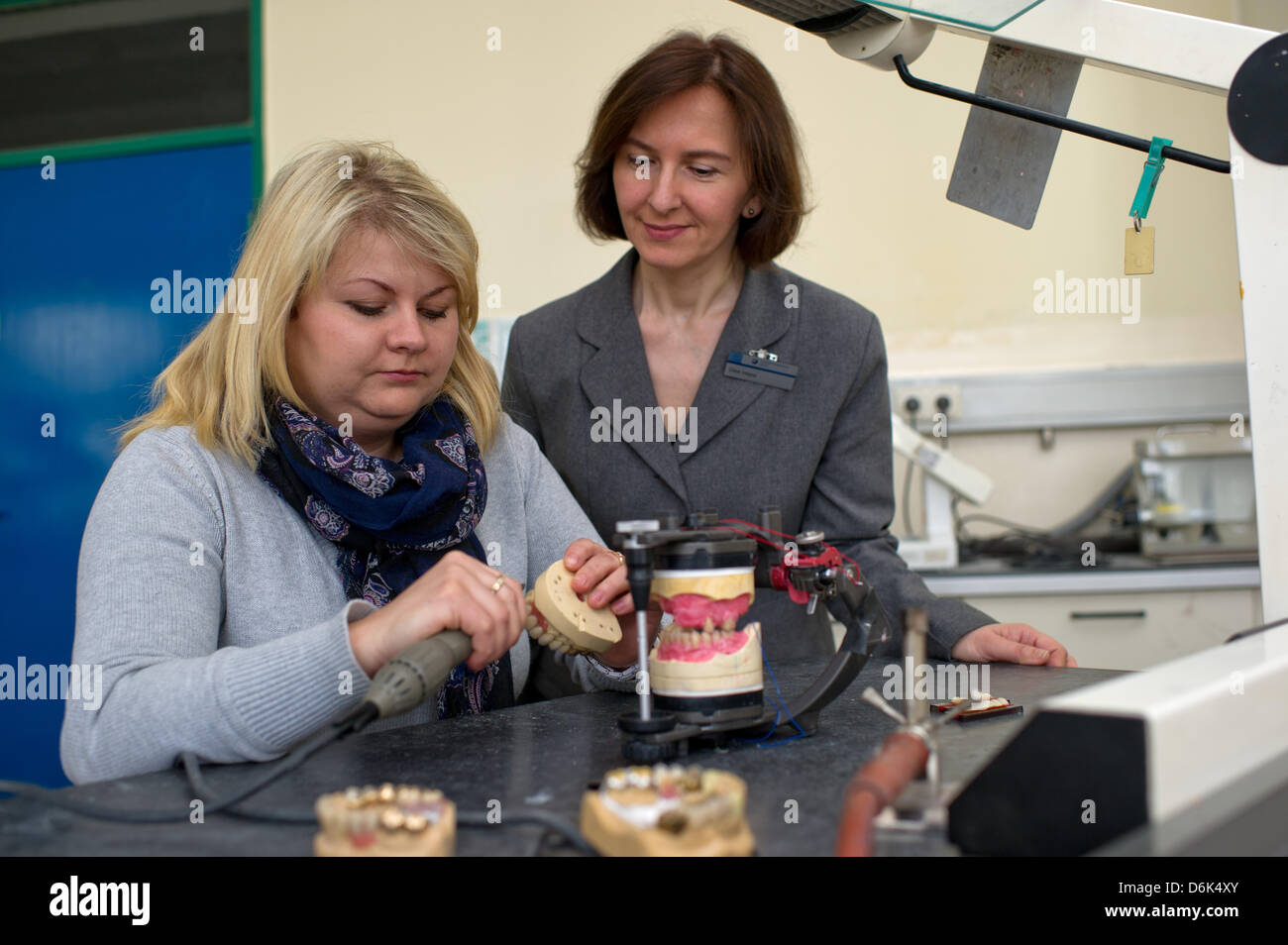 The Polish dental technician Eva Fijalkowska (L) sits in a dentistry